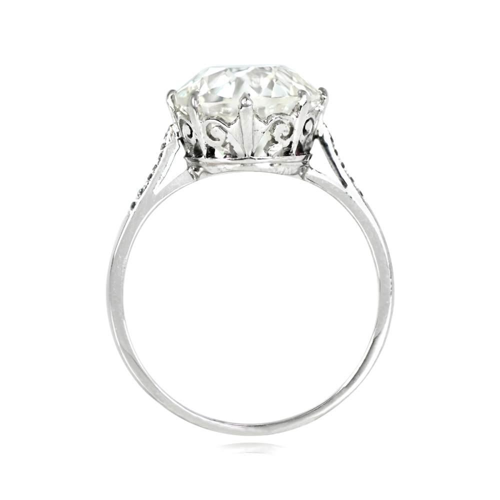 Behold the captivating allure of this exquisite Art Deco diamond ring, a true testament to timeless elegance. At its heart lies a resplendent 4.25-carat old European cut diamond, emanating a breathtaking brilliance. Its enchanting presence is