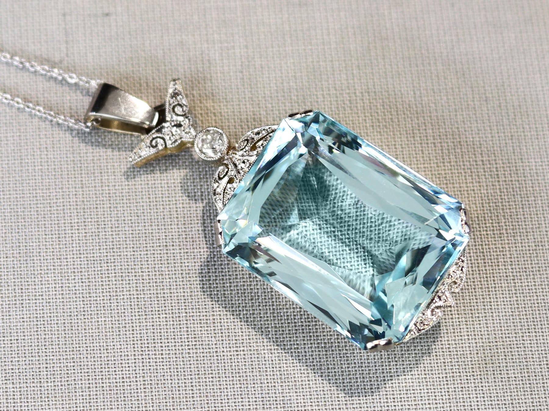Emerald Cut Antique 42.68Ct Aquamarine and 0.16Ct Diamond 12k Yellow Gold Pendant Circa 1935 For Sale