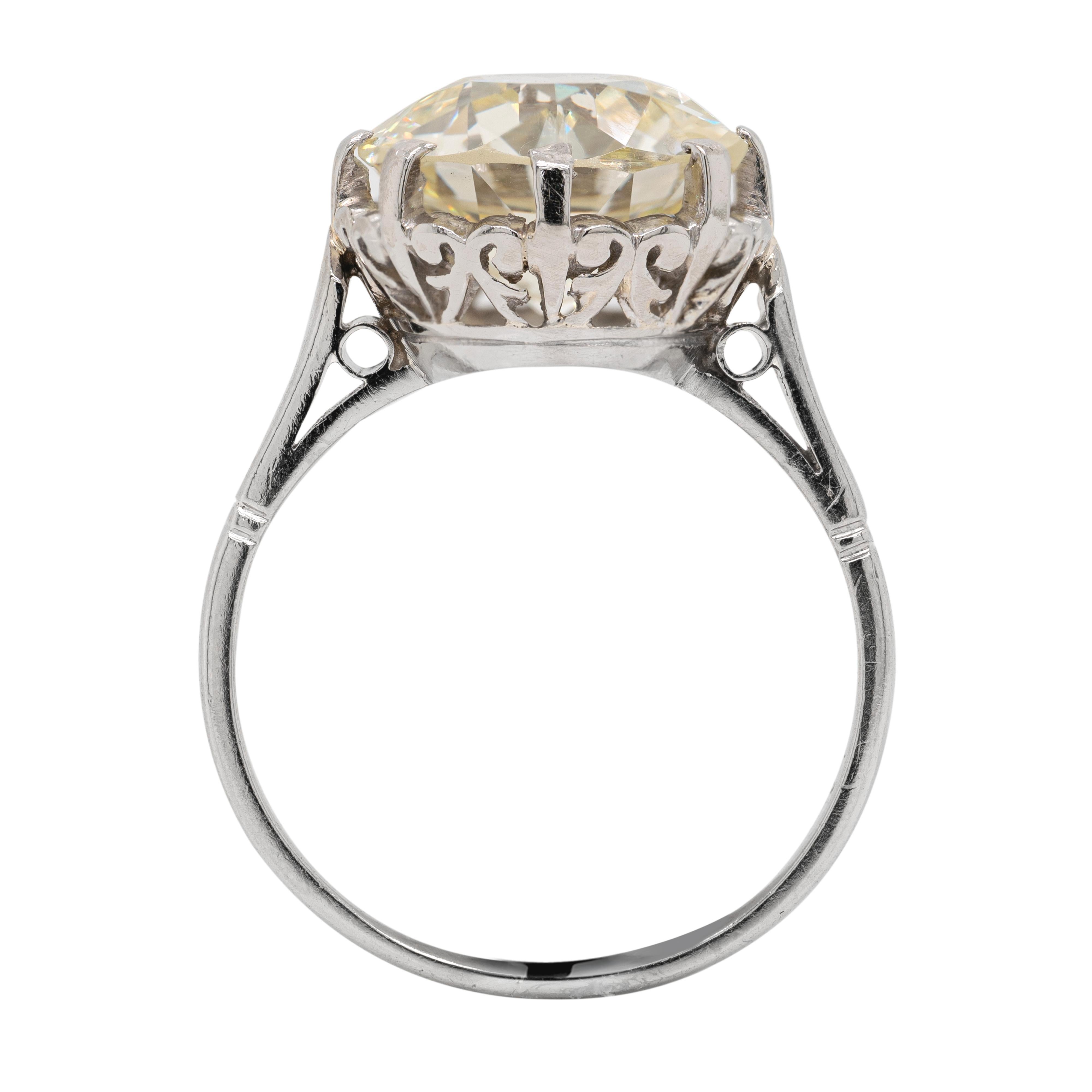 This magnificent antique solitaire engagement ring features an old European cut diamond weighing 4.29 carats, mounted in an intricate open work crown eight claw illusion setting. The impressive Edwardian cut stone is set in its original late 1920's