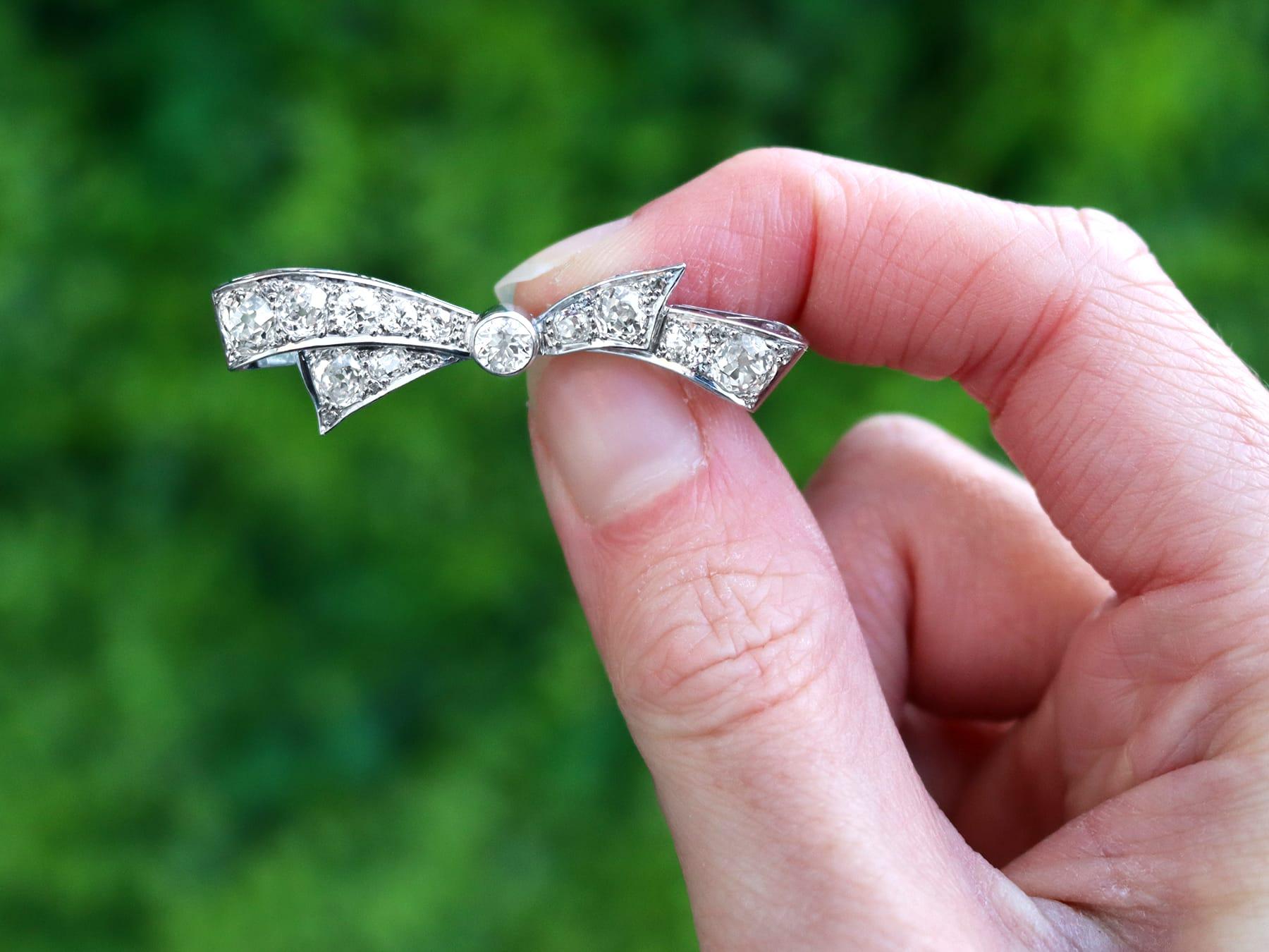 A stunning, fine and impressive 4.45 carat diamond and platinum bow brooch; part of our antique jewelry and estate jewelry collections

This stunning, fine and impressive antique diamond brooch has been crafted in platinum.

The brooch has been