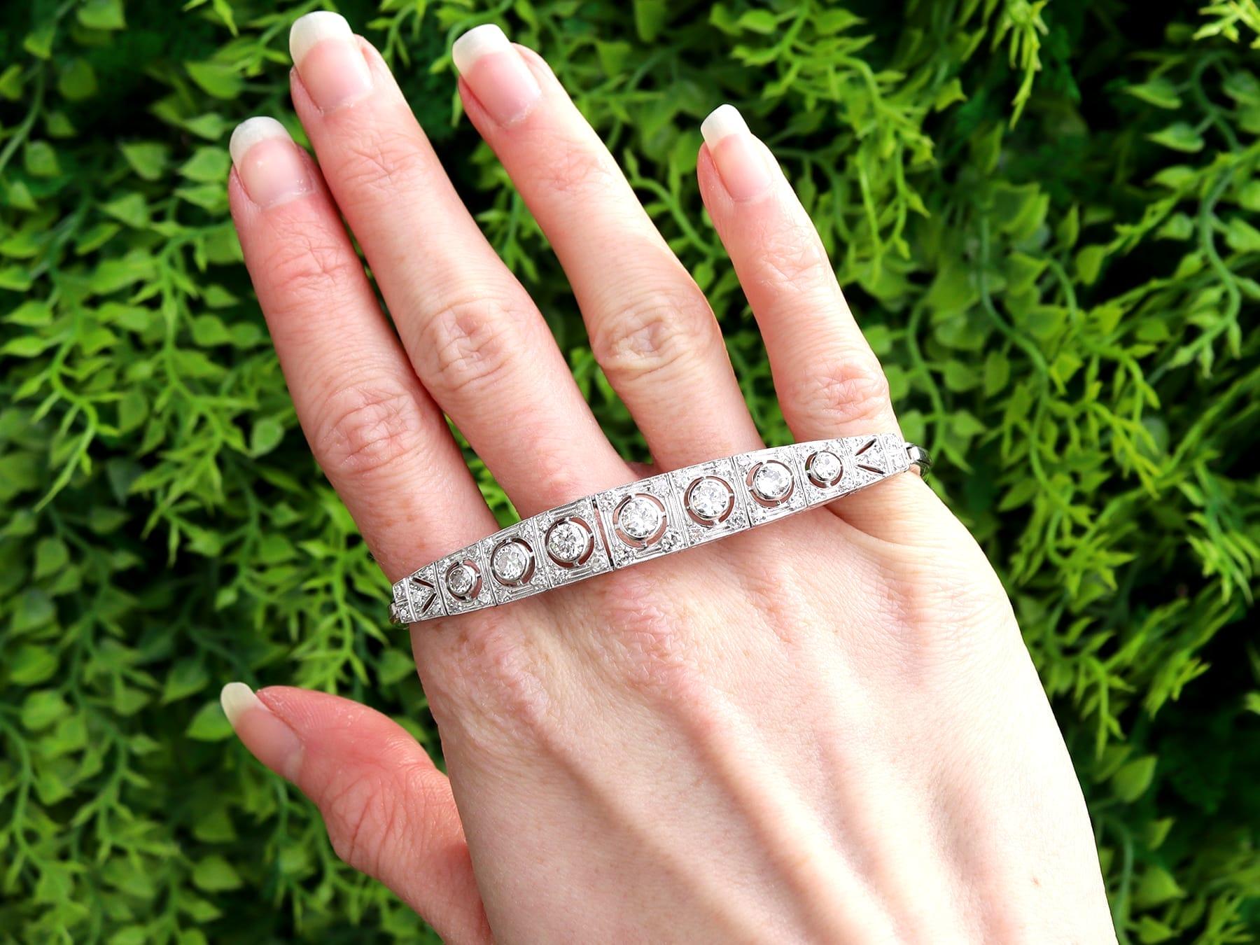 A stunning, fine and impressive antique 4.51 carat diamond, 18 karat white gold and platinum bracelet; part of our diverse diamond jewelry collection.

This stunning, fine and impressive antique diamond bracelet has been crafted in 18k white gold