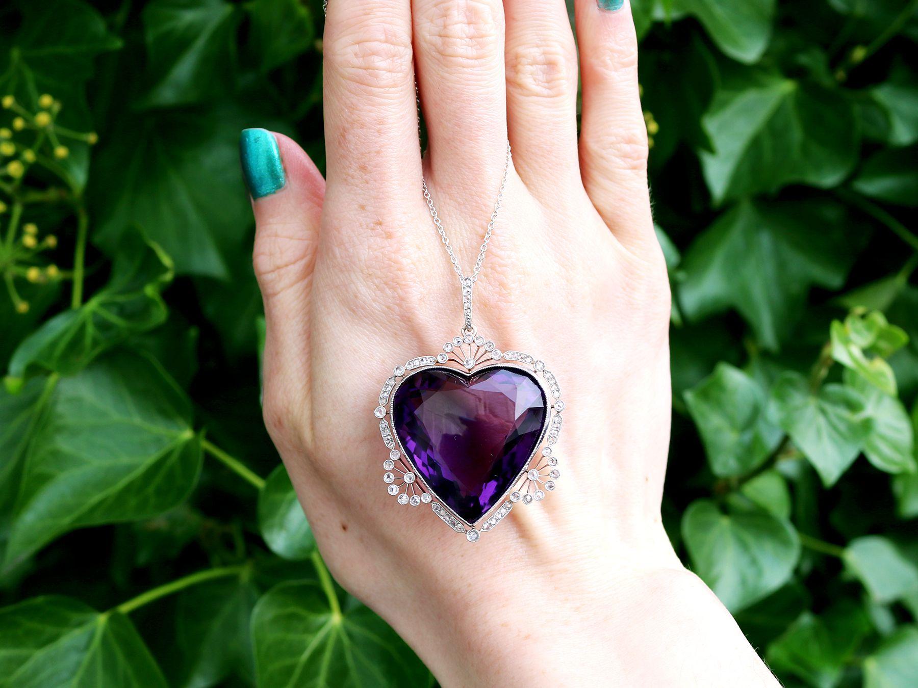 A magnificent, fine and impressive 45.27 carat amethyst and 0.95 carat diamond, 18 karat yellow gold and platinum set heart pendant; part of our diverse antique jewelry and estate jewelry collections. 

This magnificent, fine and impressive amethyst