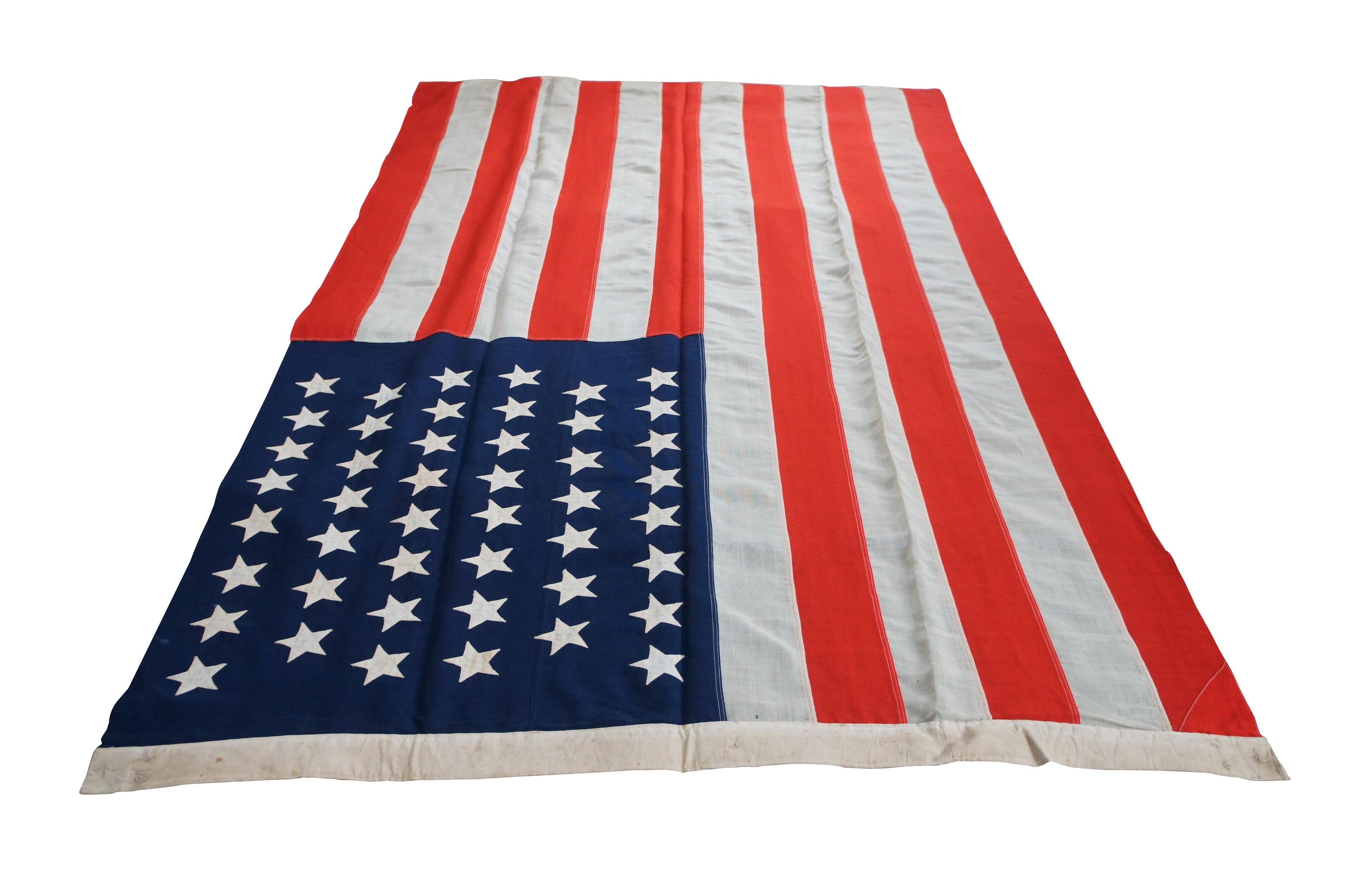 Antique forty six star large wool American flag by Horstmann Company, circa 1908-1912.

Horstmann firm was founded by William H. Horstmann (1785-1850), who had immigrated to Philadelphia from Germany. Horstmann bought out a local swordmaker in 1828