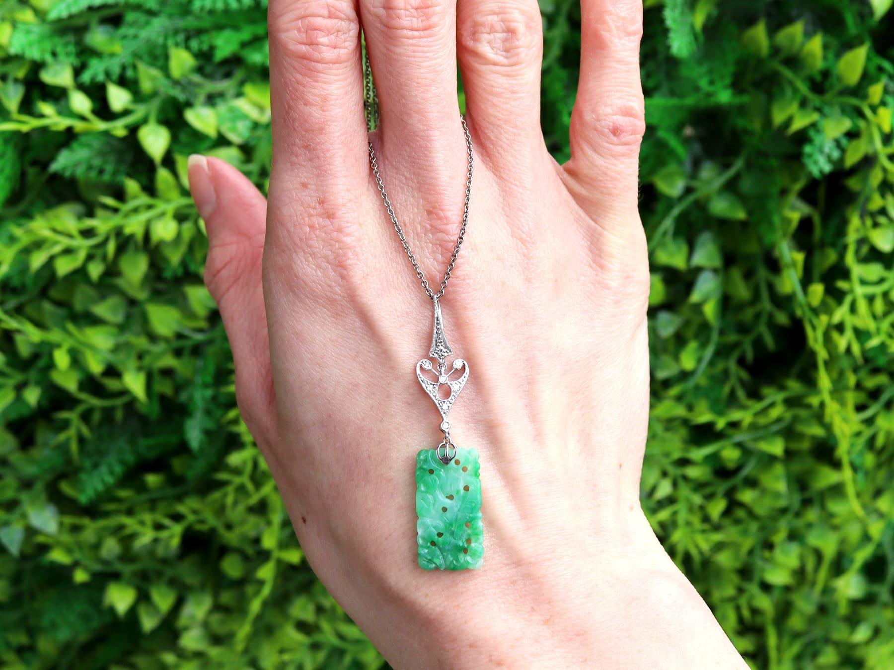 A fine and impressive antique 1920's 4.60 carat jadeite and 0.28 carat diamond, 18k white gold and platinum set pendant; part of our diverse antique jade jewellery collections.

This fine and impressive antique pendant has been crafted in 18k white