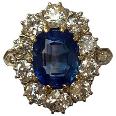 Antique 4.7 Carat SSEF Kashmir Sapphire and Diamond Cluster Ring