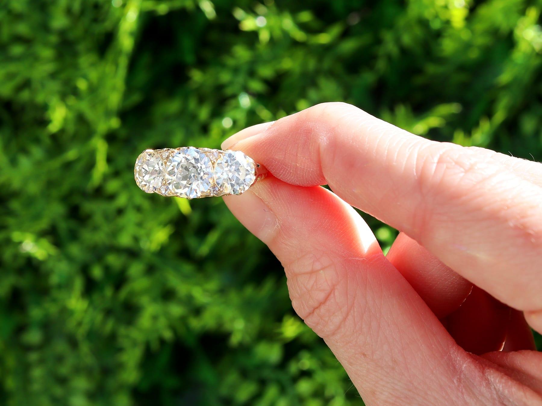 A magnificent, fine and impressive antique 4.76 carat diamond and 18 karat yellow gold three stone ring; part of our antique jewelry/estate jewelry collections.

This magnificent, fine and impressive antique trilogy ring has been crafted in 18k