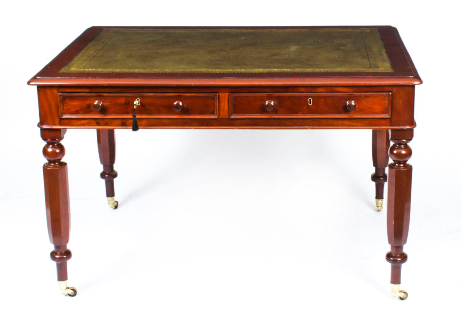 This is a superb antique William IV partners writing table, crafted from beautiful mahogany and dating from Circa 1830.
 
The rectangular top features a moulded edge with an inset gold tooled green leather writing surface over four drawers, two on