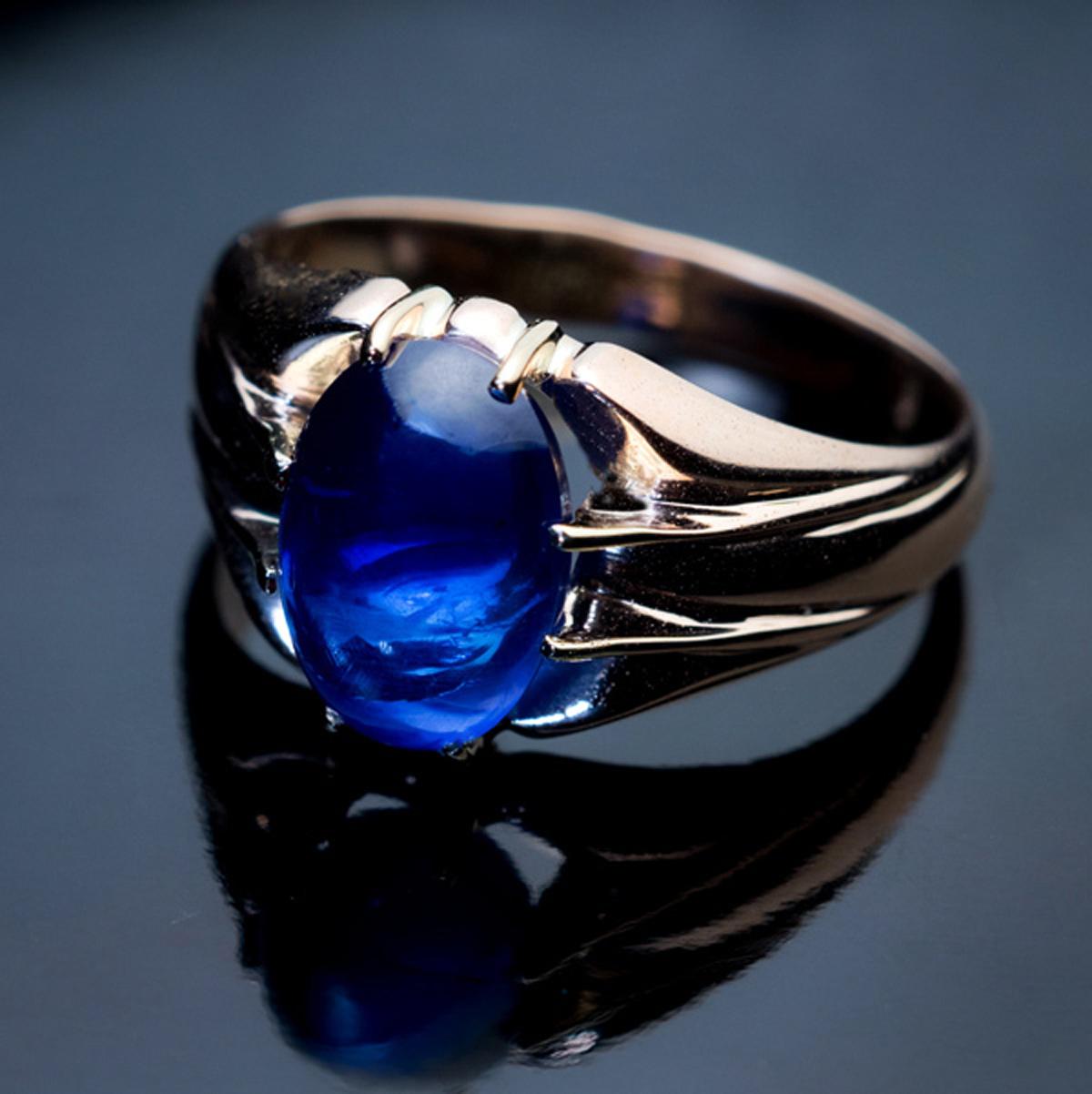 Made in Moscow between 1908 and 1917

This antique 14K gold unisex ring is prong-set with a 5.07 ct cabochon cut natural sapphire of an excellent medium blue color. The sapphire measures 10.73 x 7.46 x 6.45 mm.

The ring is marked with 56 zolotnik