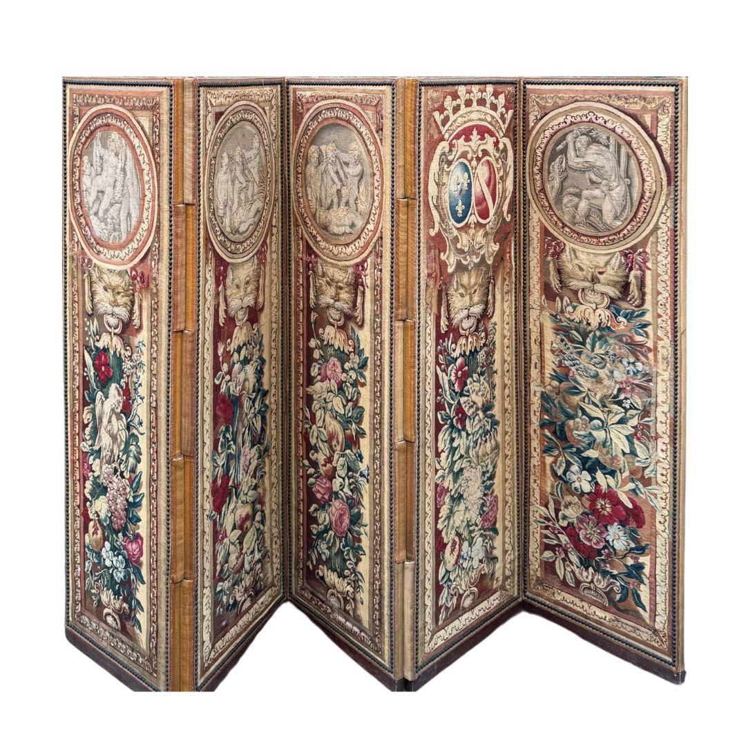 Antique 18th Century Brussels Paravant Tapestry
5 Panels
133 x 185 in, 340 x 470 cm (full paravant)
59 x 23 in, 150 x 60 cm (individual panel)

Five-leaf screen consisting of five panels of tapestry, decorated with putti in grisaille medallions