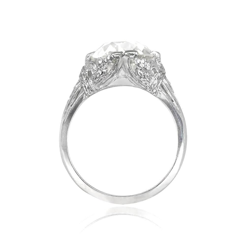 Step into a realm of timeless elegance with this extraordinary antique engagement ring from the Edwardian era, circa 1910. At the heart of this captivating piece sits a magnificent 5.03 carat old European cut diamond, boasting an enchanting L color