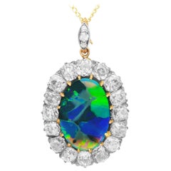 Antique 5.72 Carat Harlequin Opal and 7.52 Carat Diamond 12K Yellow Gold Pendant