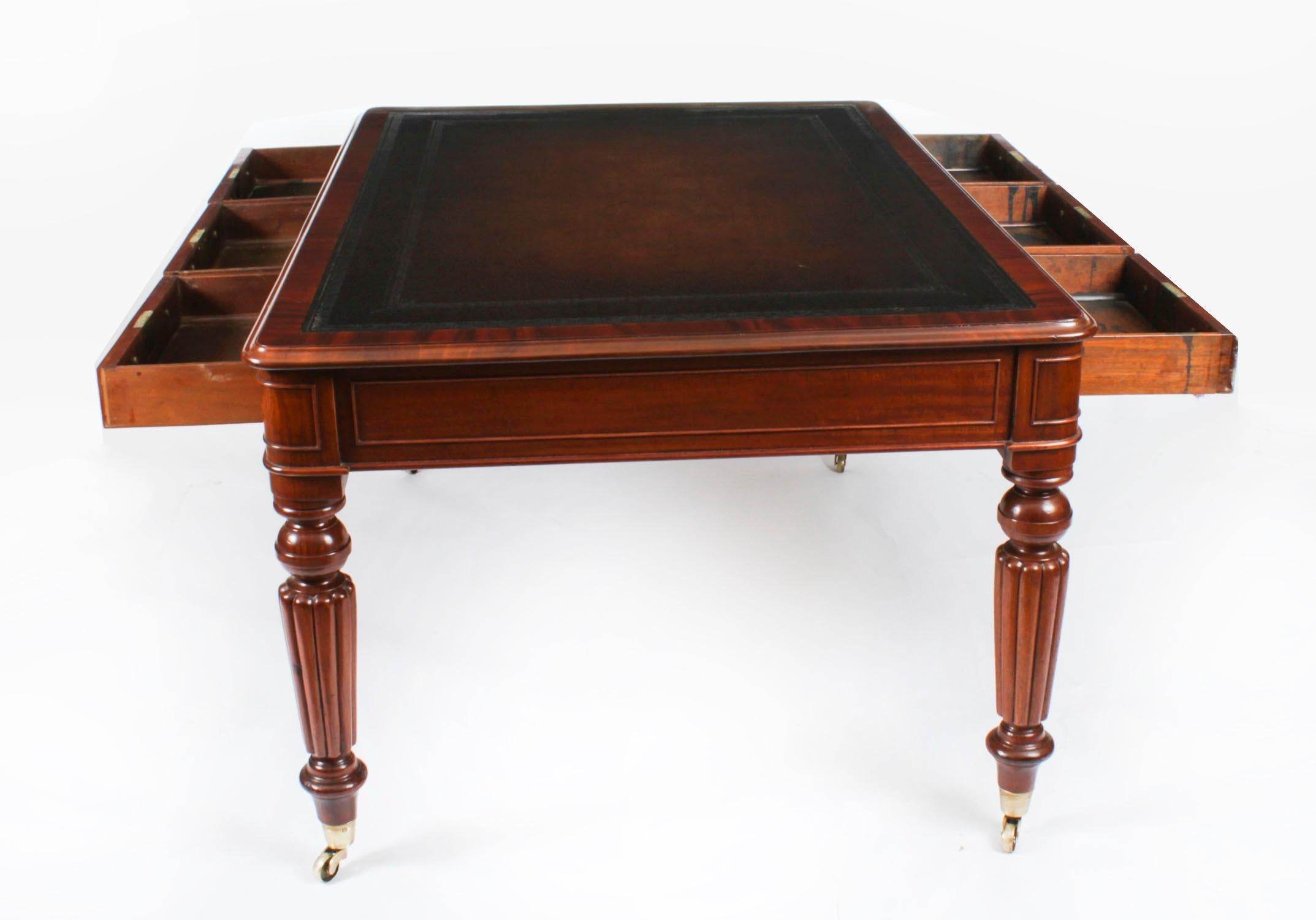 This is a superb antique William IV partners library writing table, crafted from beautiful flame mahogany and Circa 1830 in date.

The rectangular top features a moulded edge with the original inset faded brown blind tooled leather writing surface.