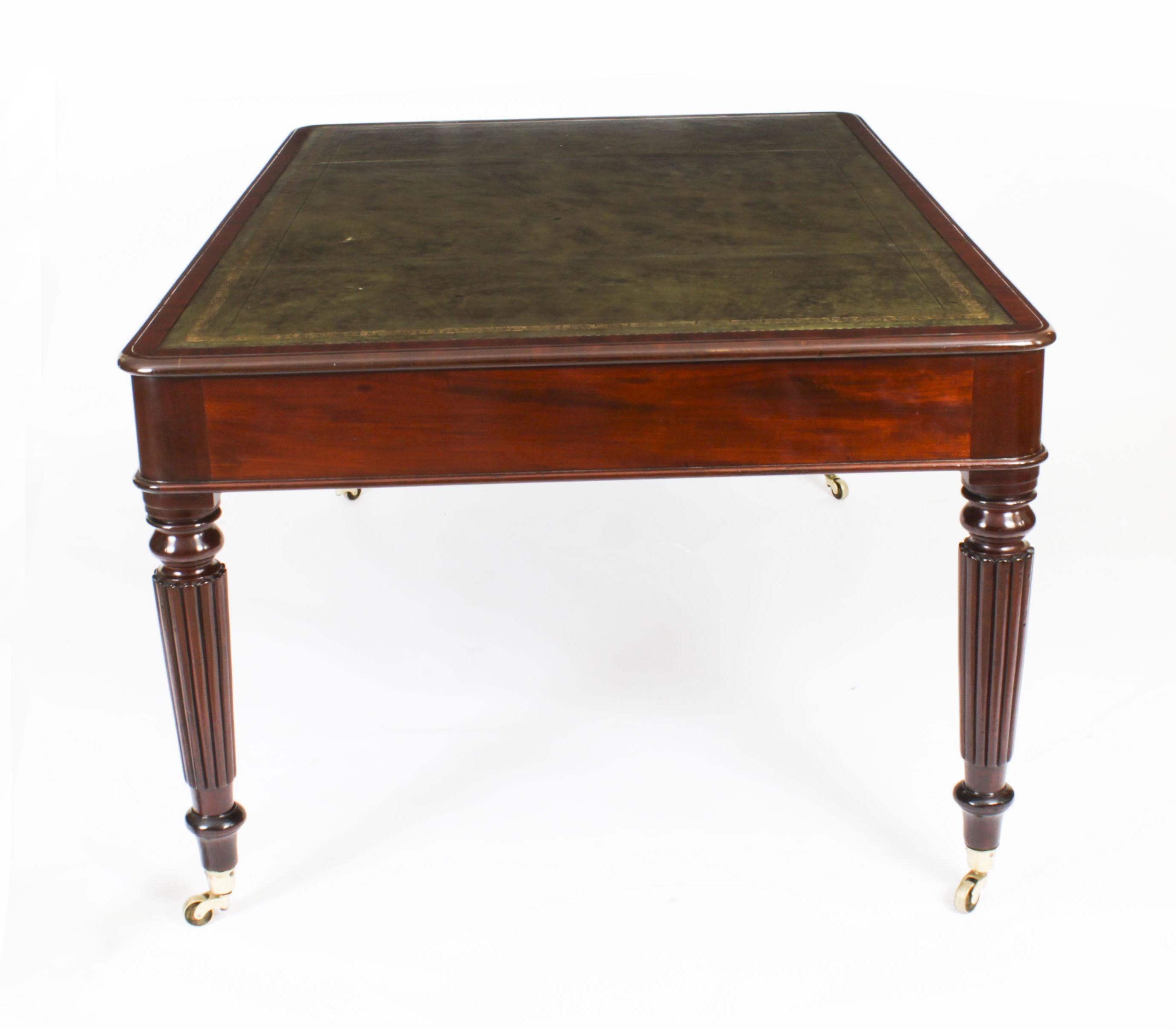 This is a superb antique William IV partners writing table in the manner of Gillows, crafted from beautiful mahogany and dating from Circa 1830.
   
The rectangular top features a moulded edge with an inset gold tooled green leather writing surface