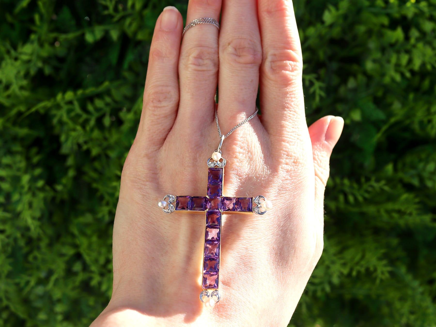 A stunning, fine and impressive antique 6 carat amethyst, pearl and 18 karat yellow and white gold cross pendant; part of our antique jewellery collections.

This stunning, fine and impressive antique pendant has been crafted in 18k yellow gold with