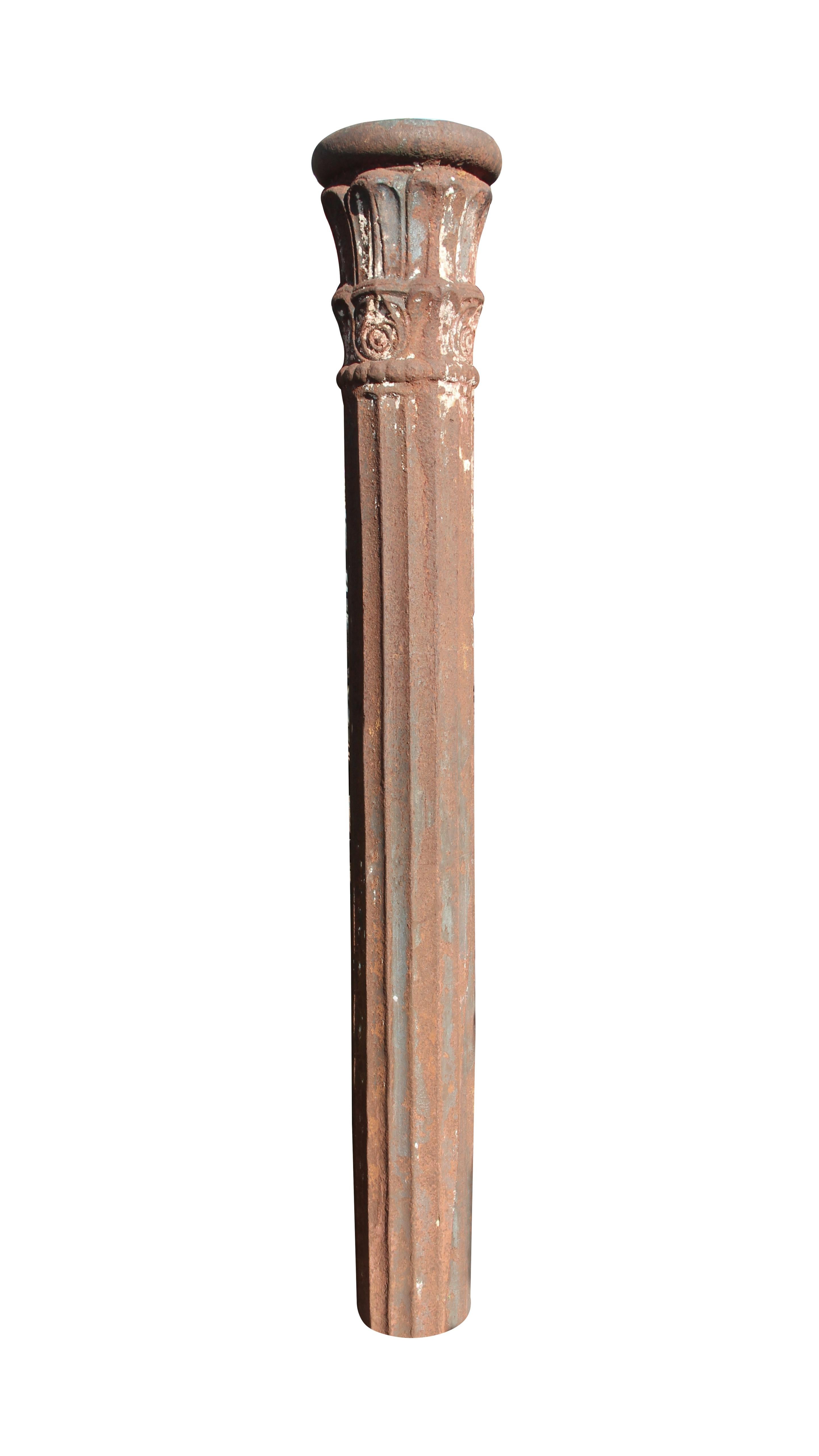 Thick cast iron column with a fluted body and decorative capital. The bottom is uneven and 6 inches will need to be cut off to make it even thus shorting its height. Please note, this item is located in our Scranton, PA location. 72 in. H x 7 in.