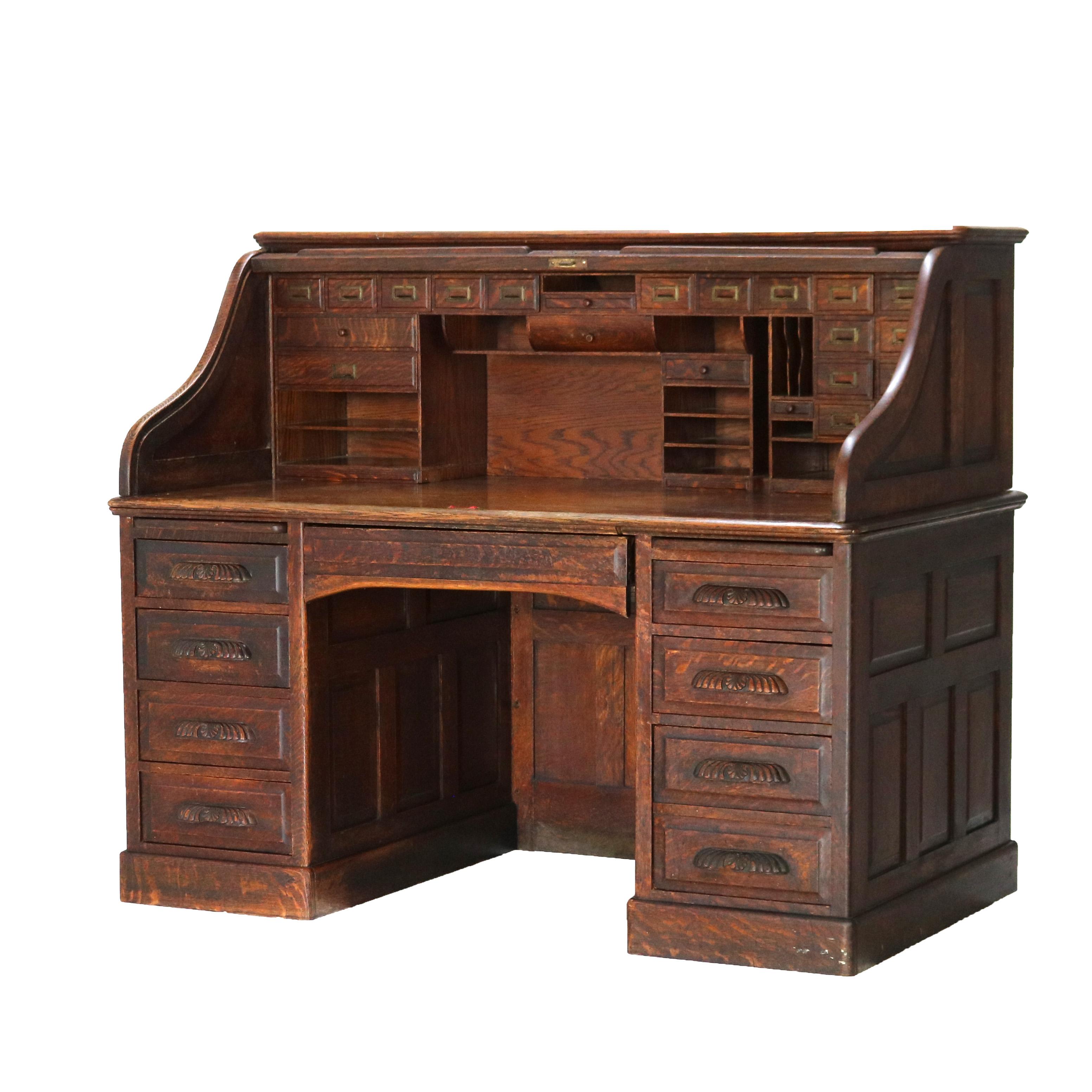 Arts and Crafts Antique 60” Oak S-Roll Top & Raised Panel Desk with 22 Interior Drawers, c1920