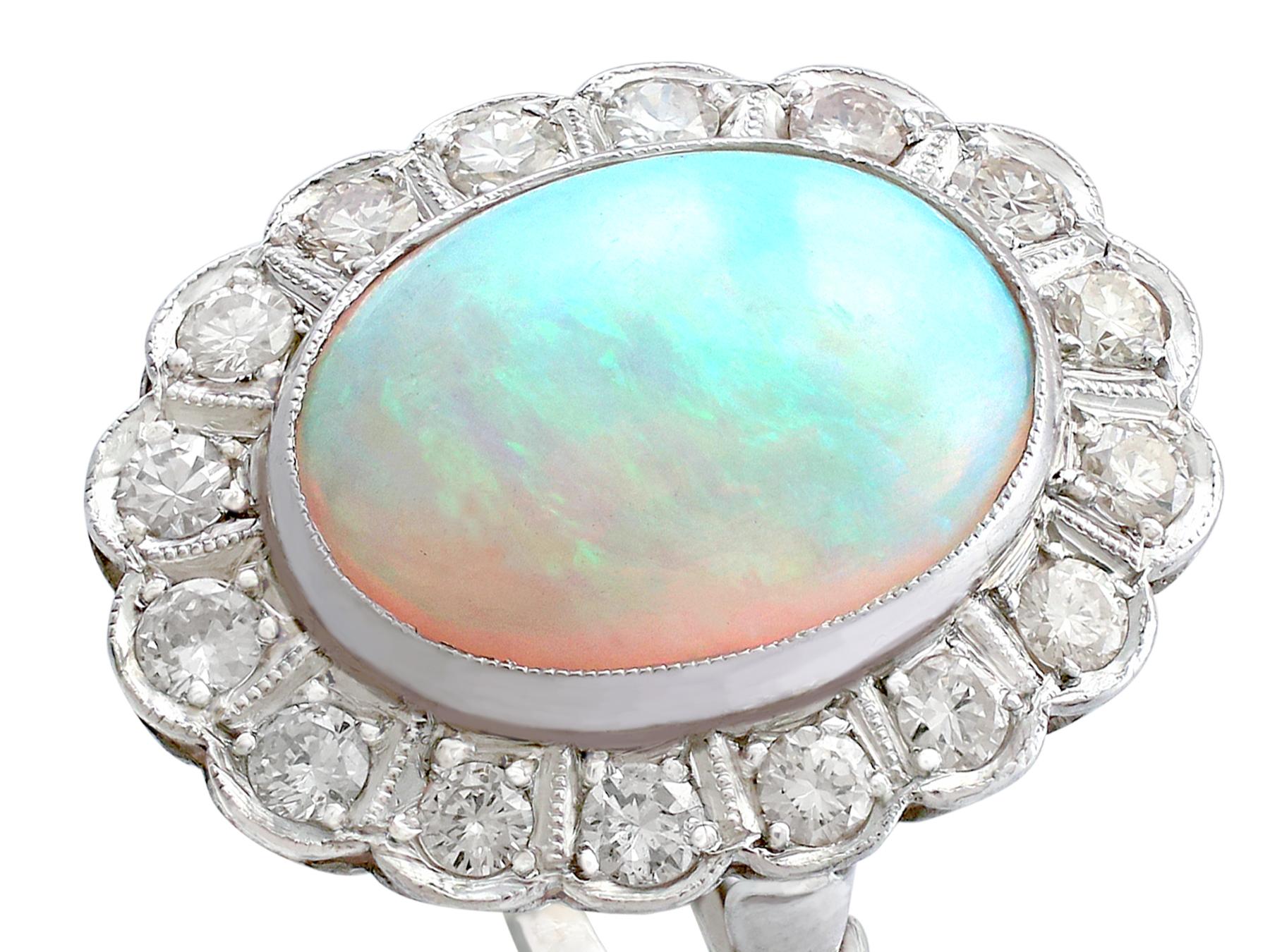 A stunning antique 6.02 carat opal and 1.48 carat diamond, platinum cluster style dress ring; part of our diverse antique jewelry and estate jewelry collections.

This stunning, fine and impressive antique opal ring has been crafted in