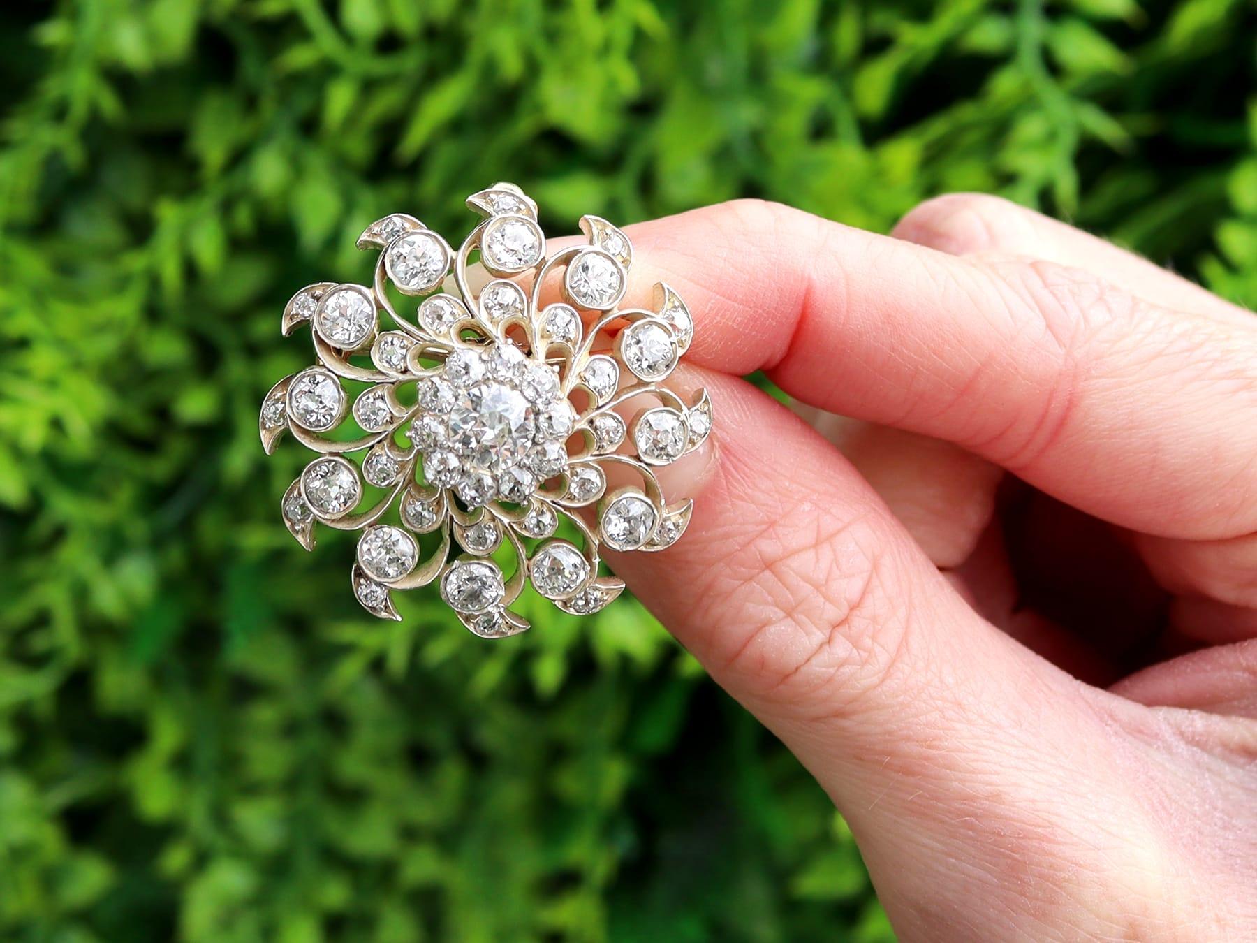 A stunning, fine and impressive antique 1880's 6.10 carat diamond and 9 karat yellow gold, silver set brooch/pendant; part of our diverse antique jewelry and estate jewelry collections.

This stunning, fine and impressive antique Victorian