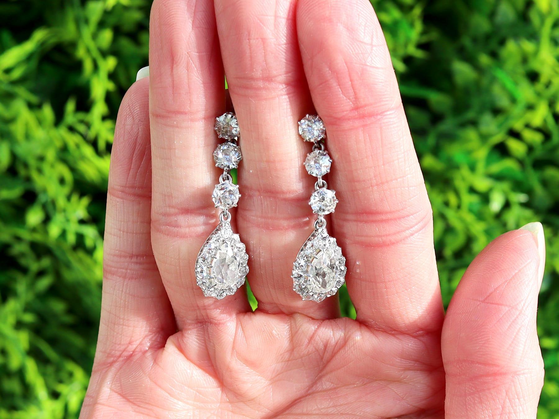 A stunning, fine and impressive pair of antique 6.22 carat diamond and platinum earrings; part of our diverse 1920s diamond jewellery collections.

These stunning, fine and impressive antique diamond earrings have been crafted in platinum.

Each