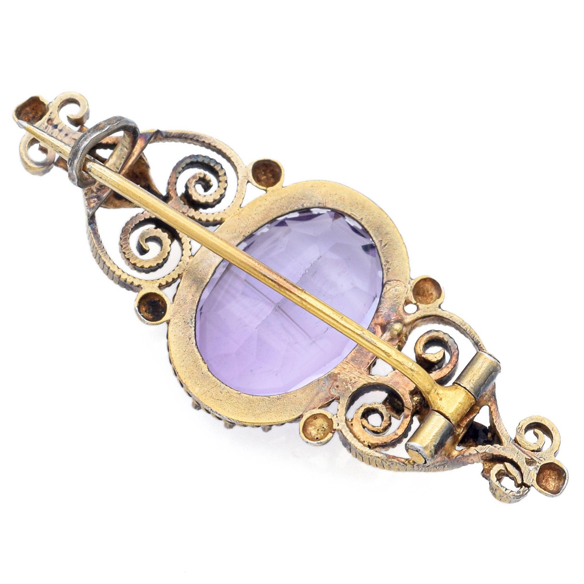 Antique silver bar brooch featuring a vibrant 6.65ct oval-cut amethyst at the center. The deep purple stone is prong set, adding striking color and dimension to the sleek, minimalist design. A refined and timeless piece with elegant antique