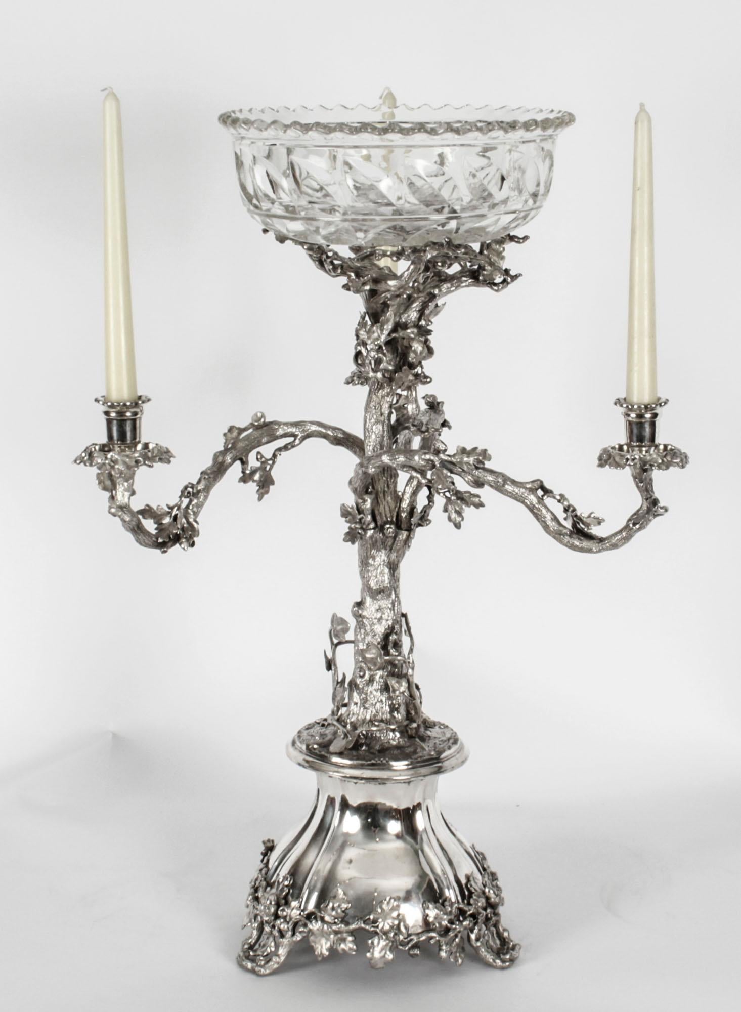 This is a wonderful and rare huge antique English Victorian silver plated bronze table centerpiece / candelabra by the renowned silversmith Elkington, Circa 1860 in date.
 
The superb centrepiece features a central pedestal in the form of an oak