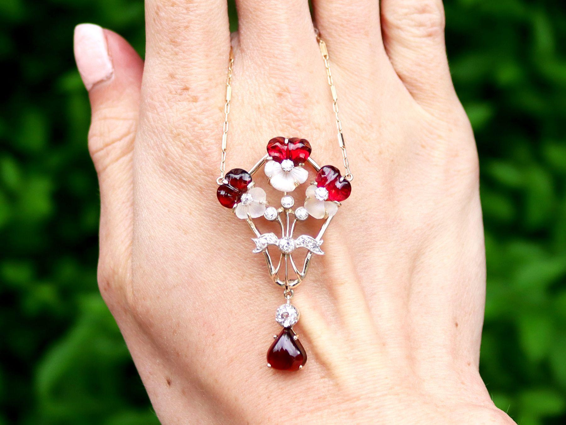 A stunning antique Victorian 6.92 carat garnet, 3.50 carat moonstone and 1.23 carat diamond, 14 carat yellow gold and 14ct white gold set pendant; part of our diverse antique jewellery collections.

This stunning, fine and impressive antique pendant