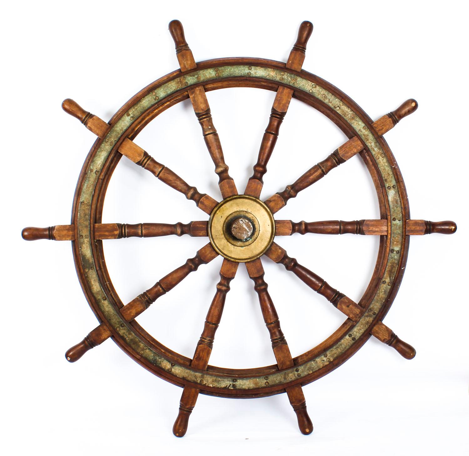 A massive Harland & Wolff ship's wheel, impressed 'Harland & Wolff, Belfast', dating from the 19th century.

The monumental 6ft 3