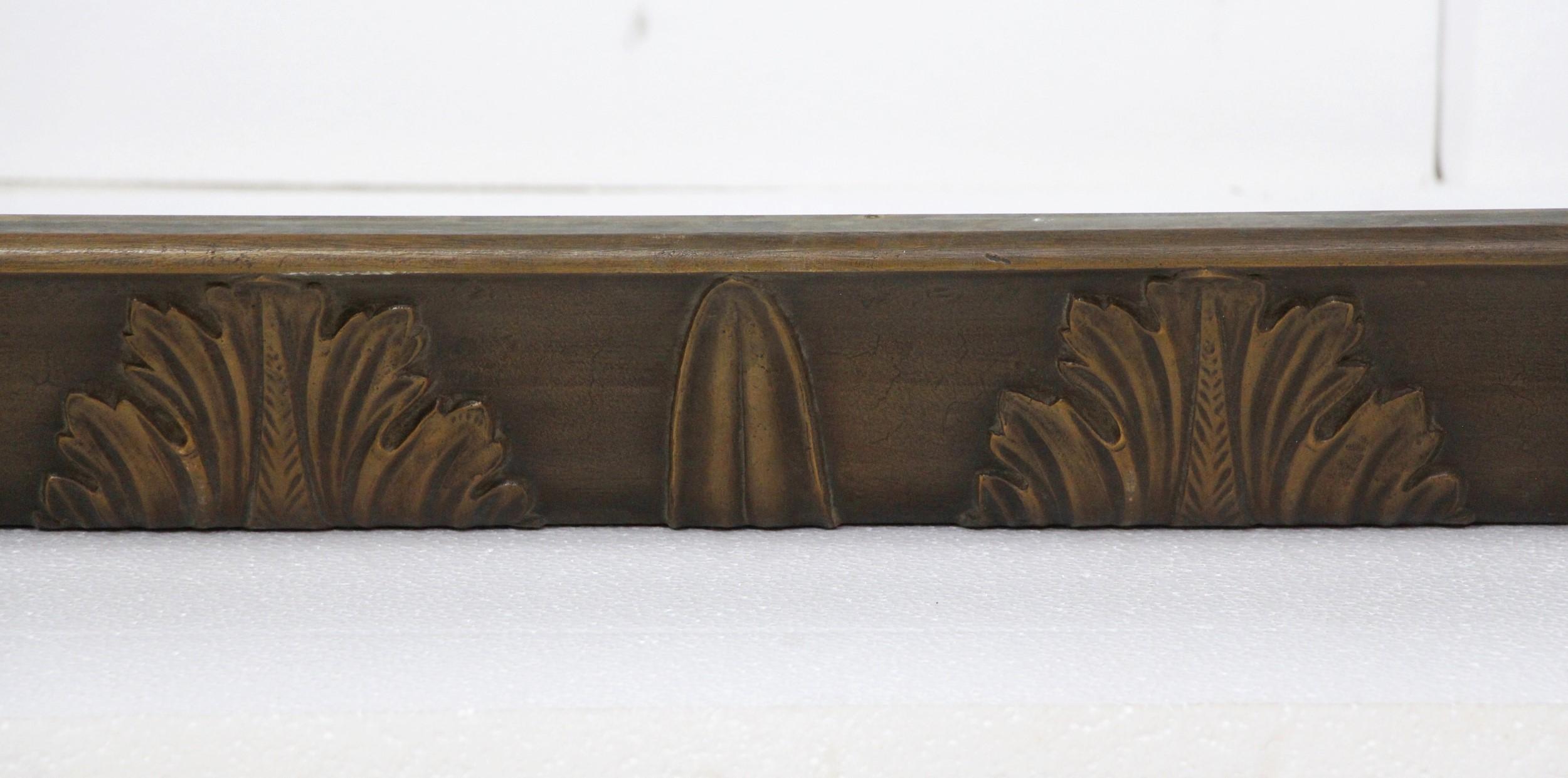 Early 20th Century antique cast bronze trim featuring ornate floral details and original dark antique patina. This can be seen at our 400 Gilligan St location in Scranton, PA.