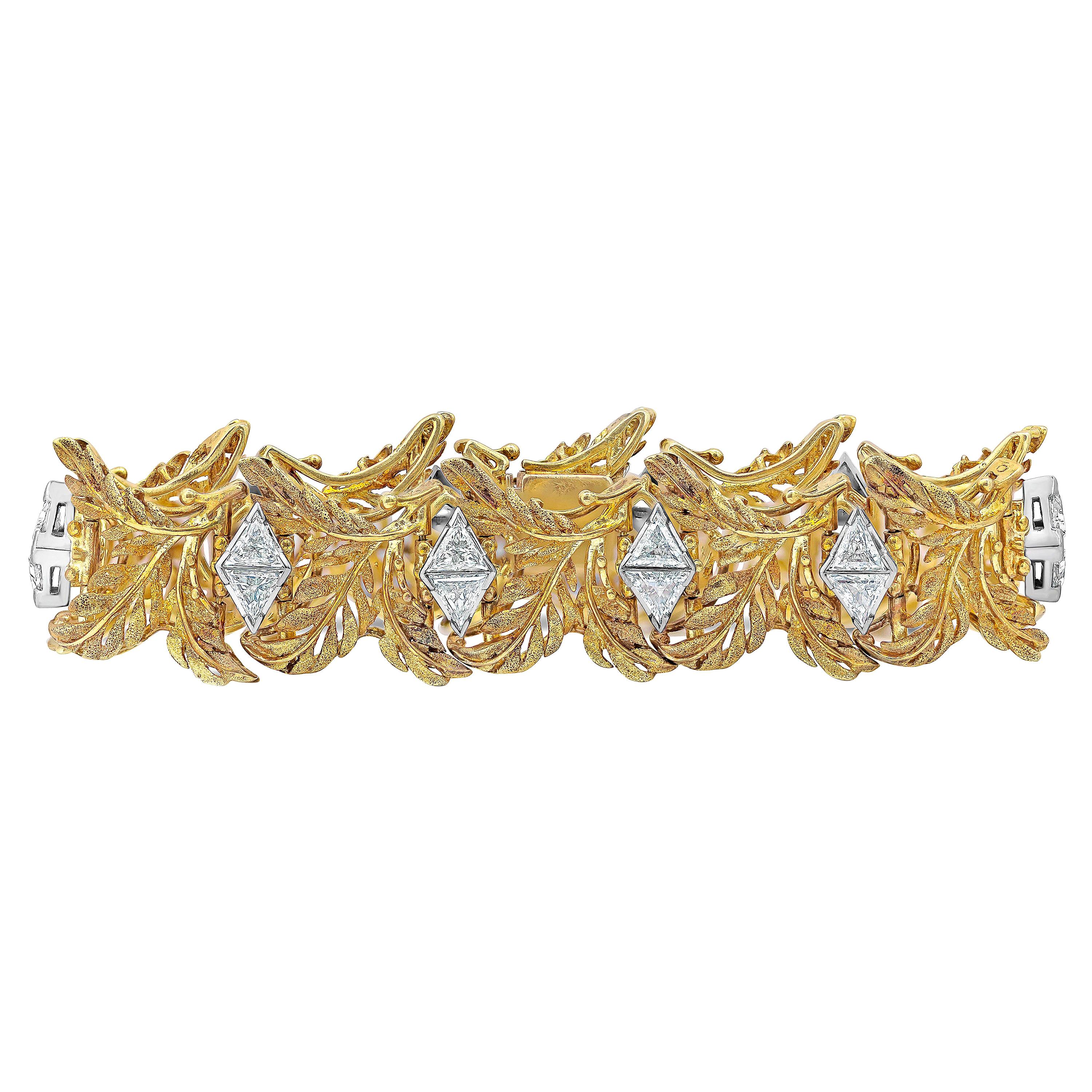 An antique and vibrant bracelet showcasing an intricately beautiful leaf-like designed set in a 18k Yellow Gold and accented with 20 trillion cut diamonds weighing 7.40 carats total.

