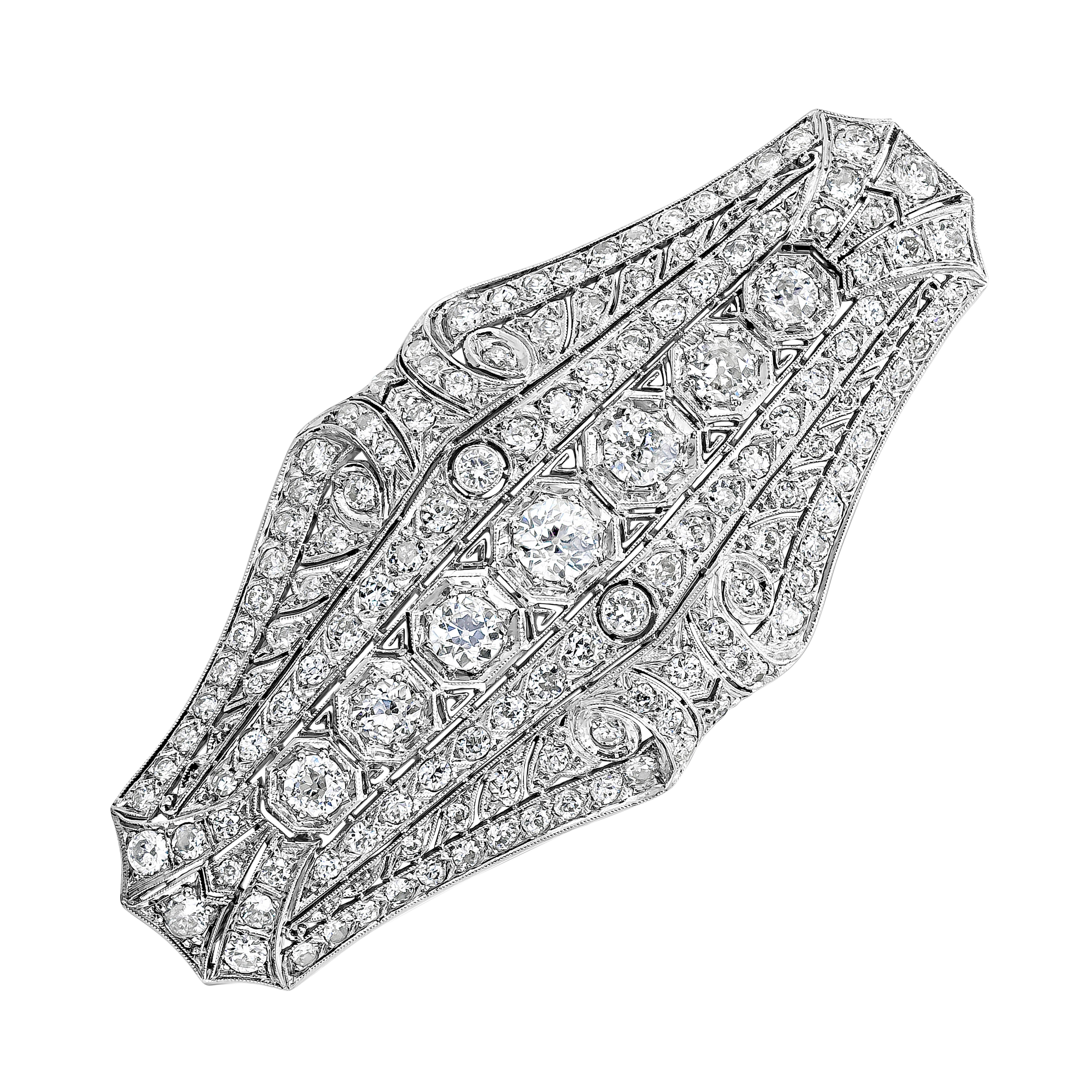 Showcasing an art deco style pendant brooch accented with 147 brilliant round cut diamonds weighing 7.48 carats total, set in an antique-looking design. Finely made in polished platinum, 2.75 inches in length and 1.25 inches in width.

