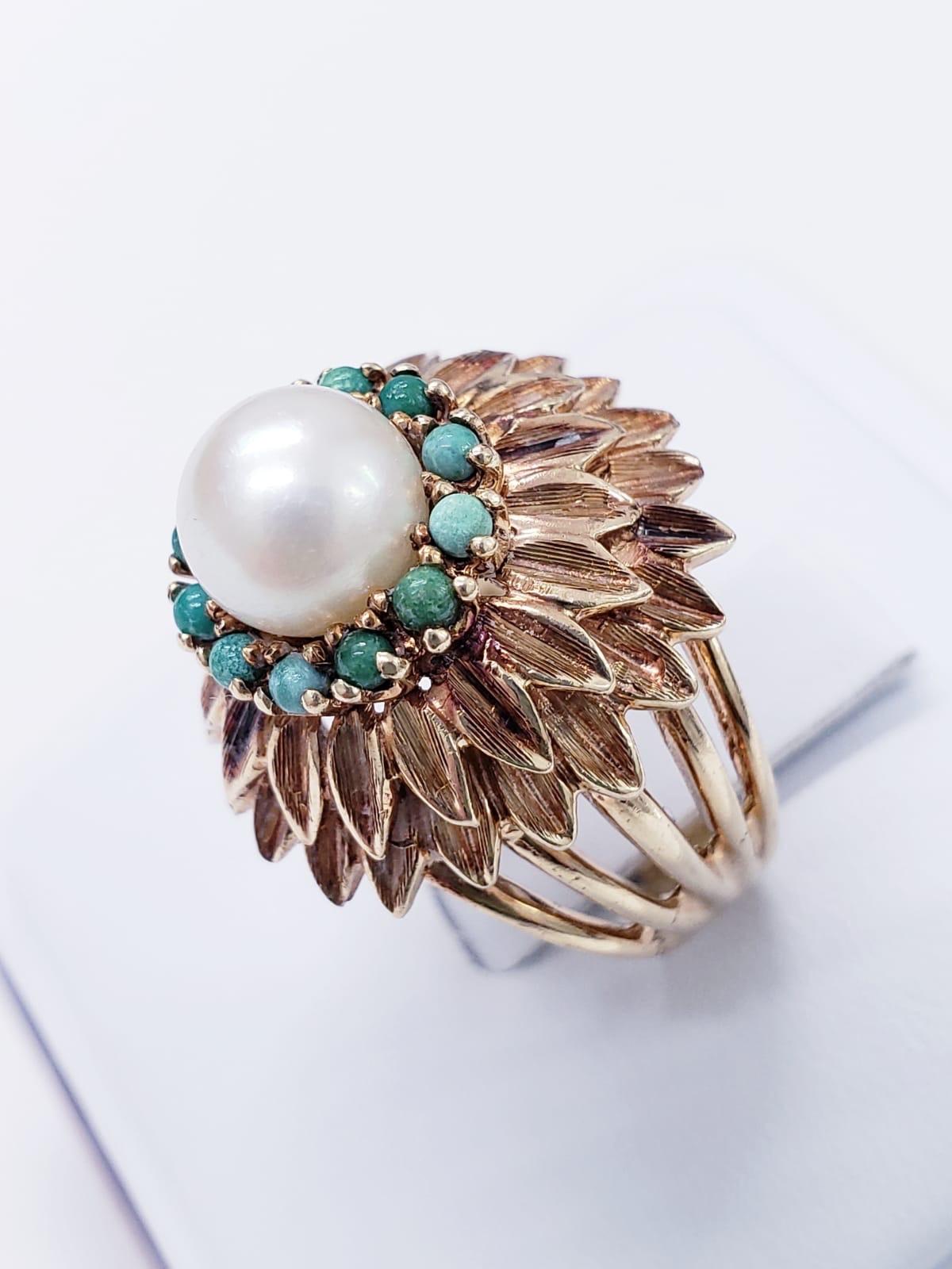 Antique Sunflower Design Pearl & Turquoise Cocktail Ring. The ring is made of 14k solid gold and featured a center pearl of 7.75mm size. The ring size is 6. The ring weights 10.5 grams.