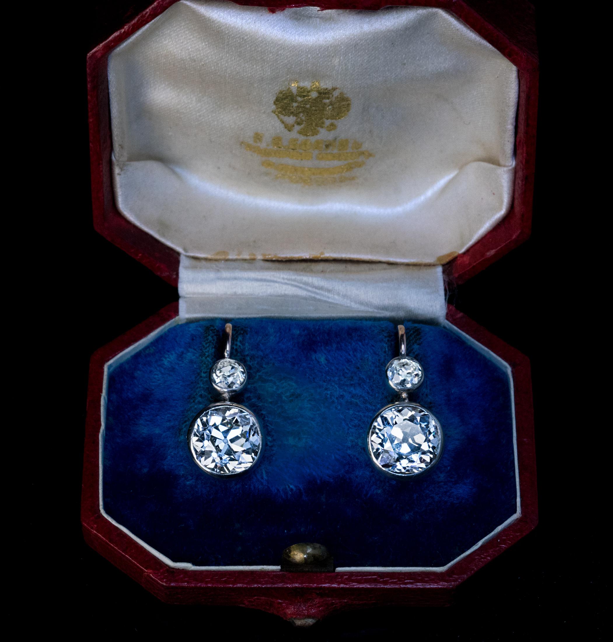 Circa 1900
These rare antique diamond earrings are handcrafted in silver-topped 14K gold (front -silver, back – gold). The earrings feature two clean and very sparkly large old mine cut diamonds: approximately 3.60 carats and 3.43 carats (VVS2 and