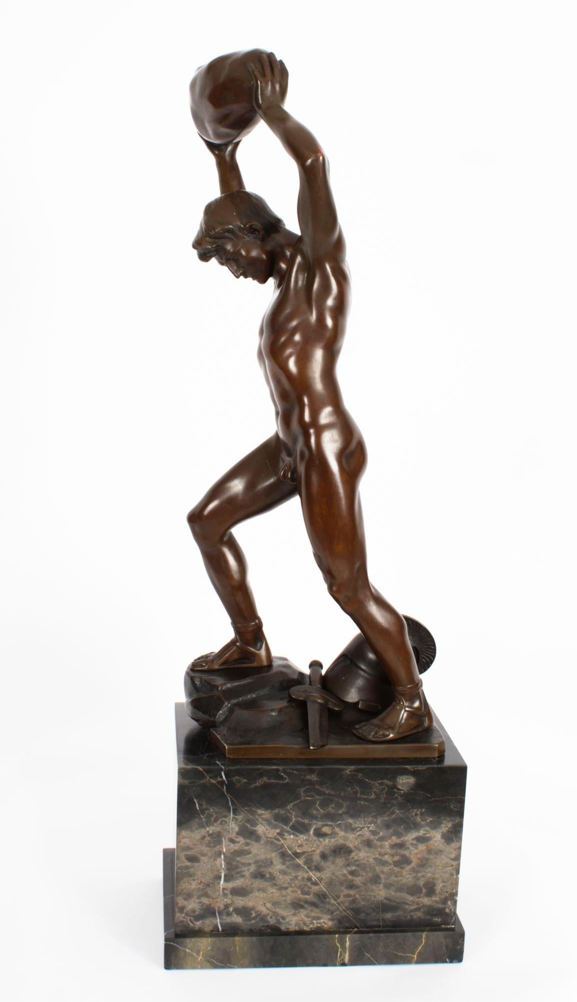 This is a large stylish Art Deco bronze figural sculpture of a Greek warrior male nude, titled 'The Enemy Below' by the renowned German sculptor Otto Schmidt-Hofer (German, 1873–1925) and bearng his signature, circa 1920 in date.
 
The warrior is