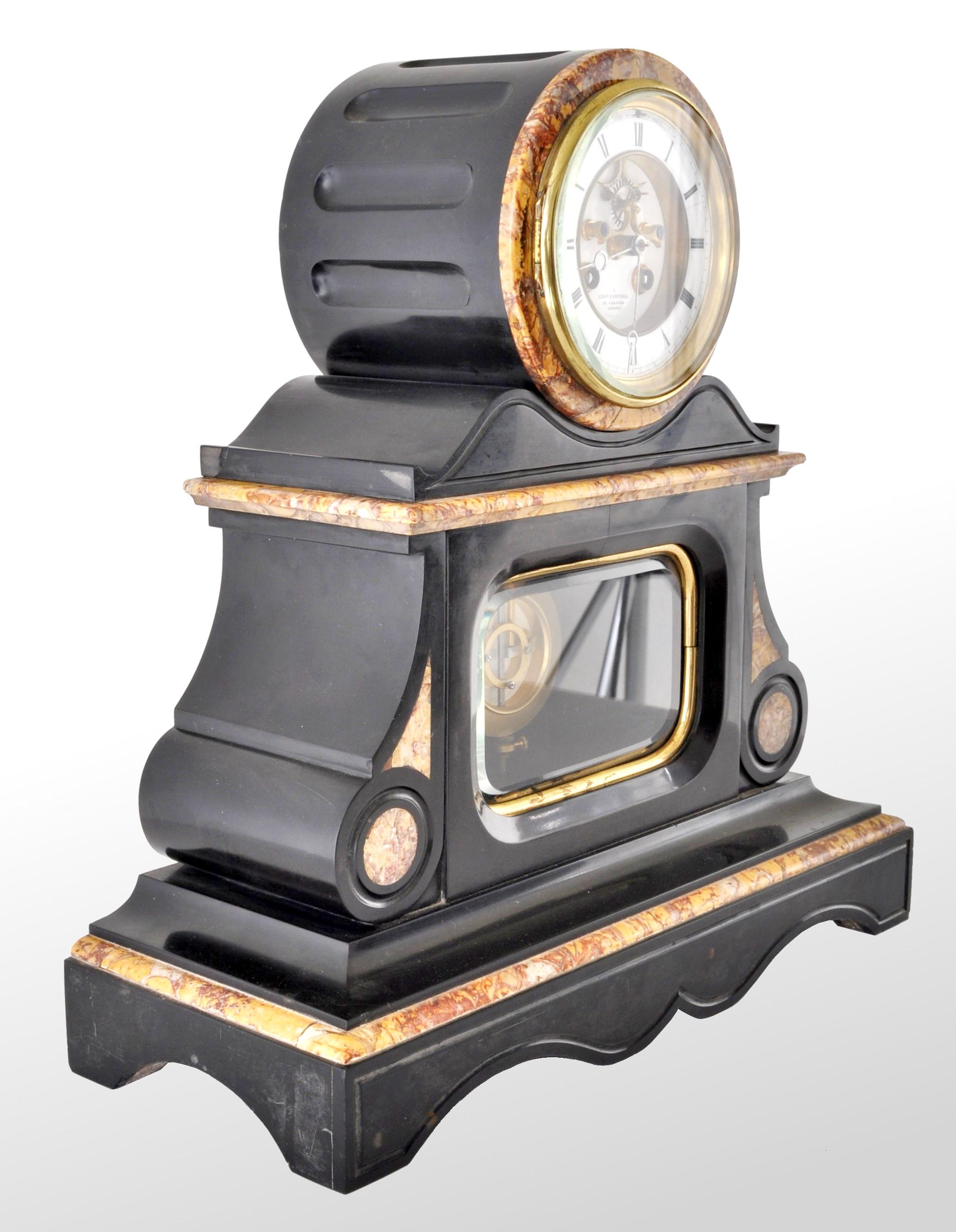 Antique 8-day marble and slate mantel clock by Henri Marc of Paris, circa 1870. A very handsome clock with variegated marble and slate case, the dial in white enamel with black Roman numerals and having an open verge escapement. The base having a