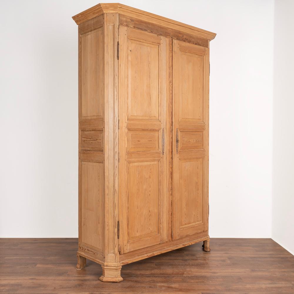 Tall and stately 8' pine French armoire.
Molding along crown and feet.
Single interior shelf included.
Traditional long escuchons, 1 key included.
Restored, strong stable and ready for use. Any cracks, separations, scratches, etc are refective