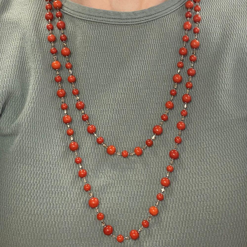 Elegance meets history in this stunning antique long chain, where alternating patterns of coral and diamonds create a mesmerizing visual rhythm. Crafted during the Art Deco era, this necklace exudes timeless charm and sophistication, handcrafted in