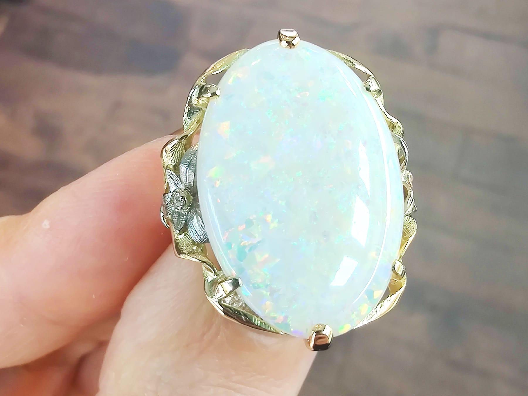 A stunning, fine and impressive antique 8.61 carat opal and 0.04 carat diamond, 15 karat yellow gold and 15 karat white gold set dress ring; part of our diverse antique opal jewellery collections.

This stunning and large antique opal ring has been