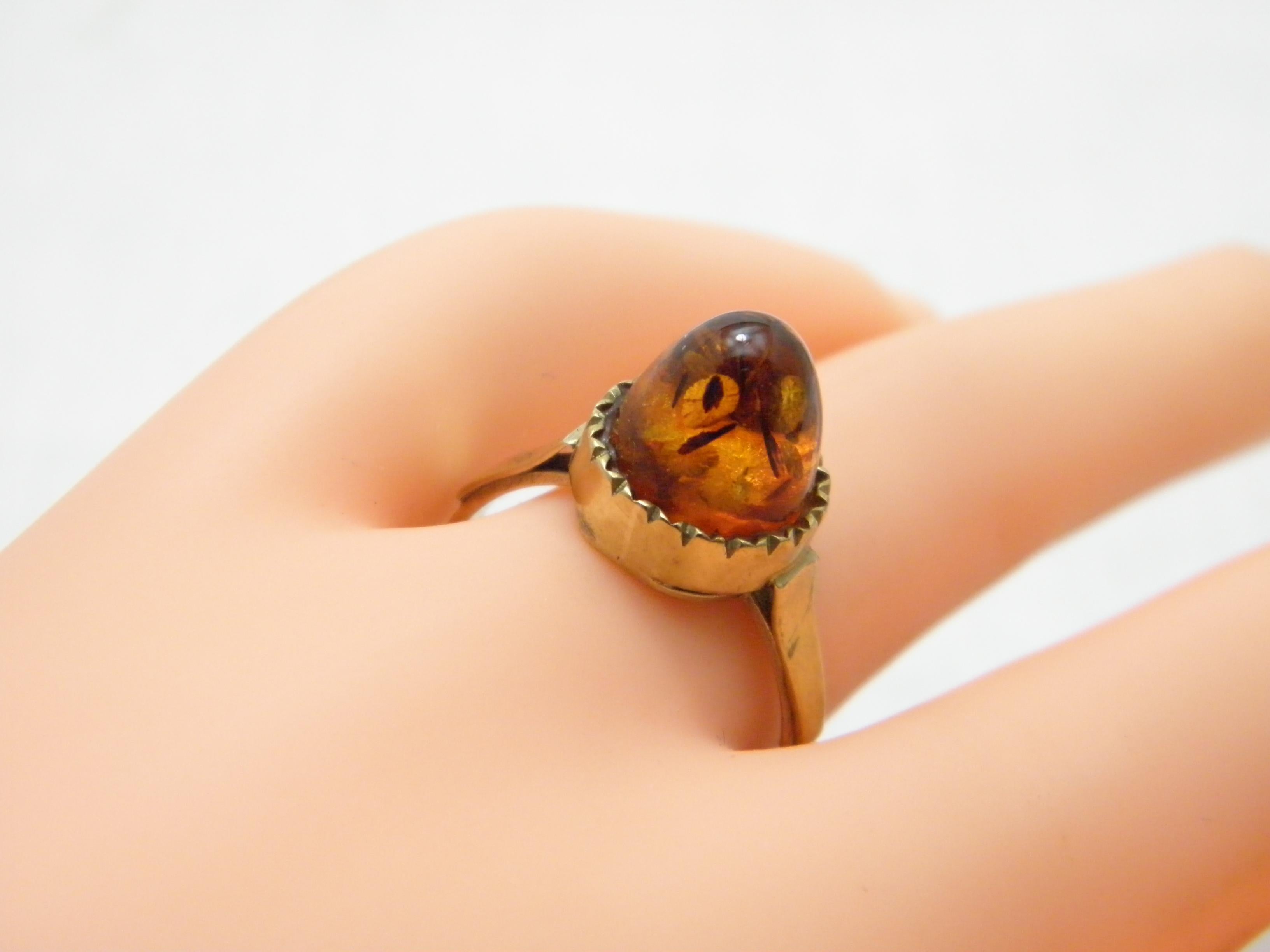 If you have landed on this page then you have an eye for beauty.

On offer is this gorgeous

8CT GOLD ART DECO AMBER BULLET STATEMENT RING

DETAILS
Material: 8ct 333/000 Thick Yellow Gold
This ring has a good shank hence ideal if resizing