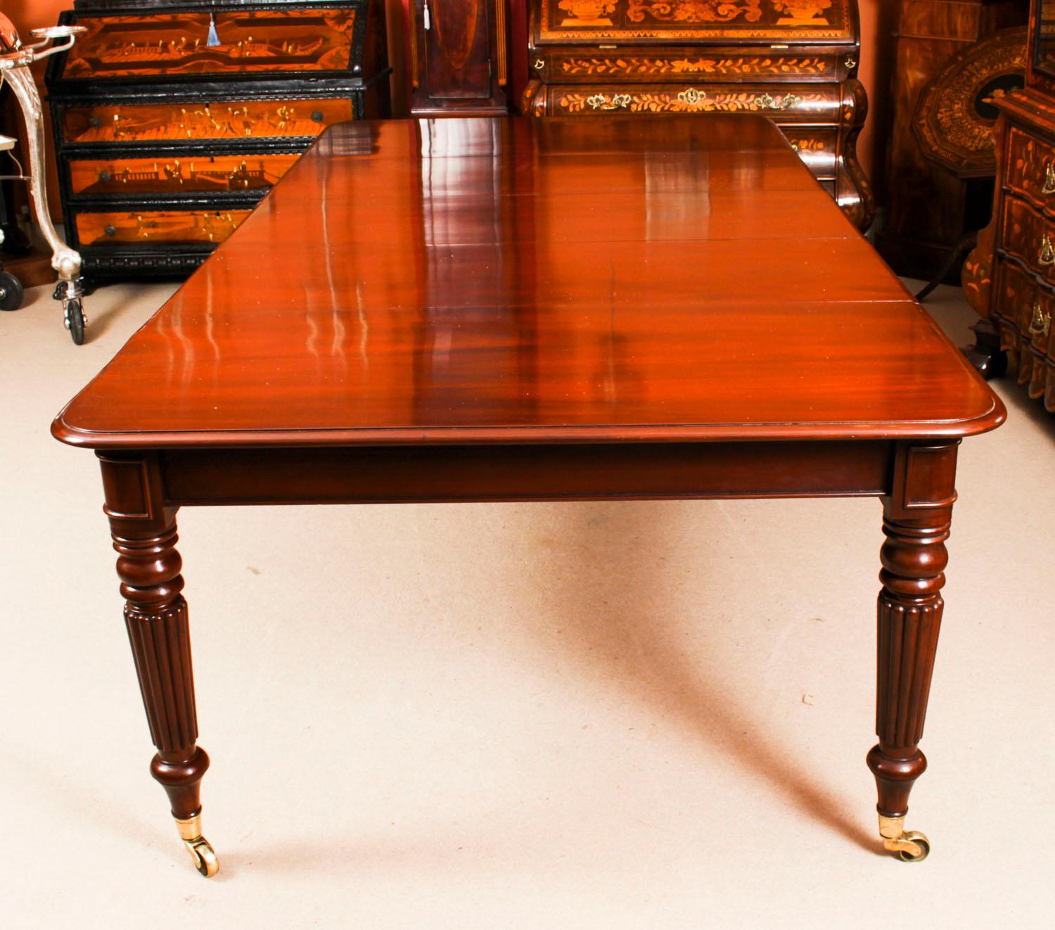 A very rare opportunity to own an antique English Regency dining room table, Circa 1820 in date, which can seat ten people in comfort.

The table is made of beautiful solid flame mahogany. This can be seen in the photos of the top with it's