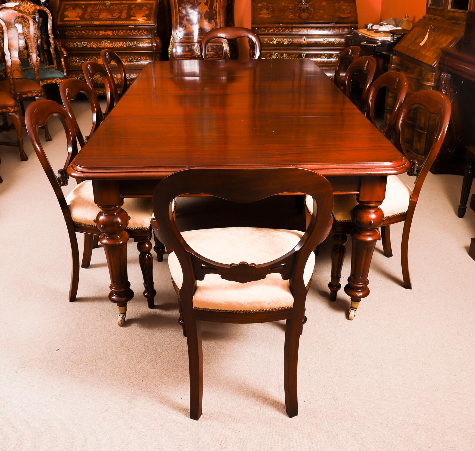 This is a magnificent antique Victorian dining set that comprised a solid mahogany wind out dining table Circa 1870 in date and a set of ten Victorian revival balloon back dining chairs.

This beautiful table is in stunning flame mahogany and has