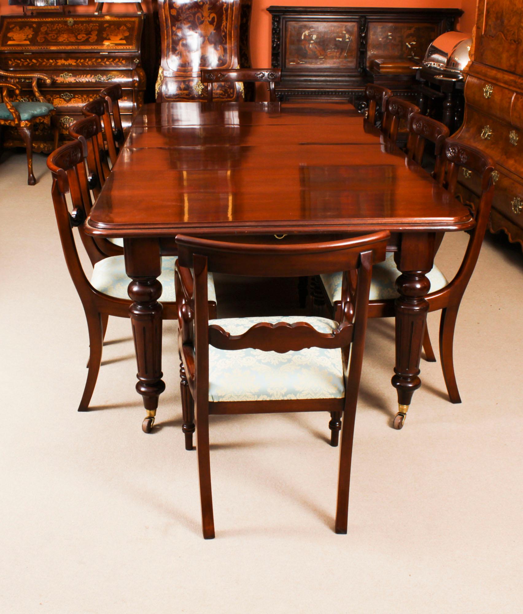 This is a magnificent antique Victorian dining set that comprised a solid mahogany wind out dining table Circa 1870 in date and a set of ten Regency revival bar back dining chairs.

This beautiful table is in stunning flame mahogany and has two