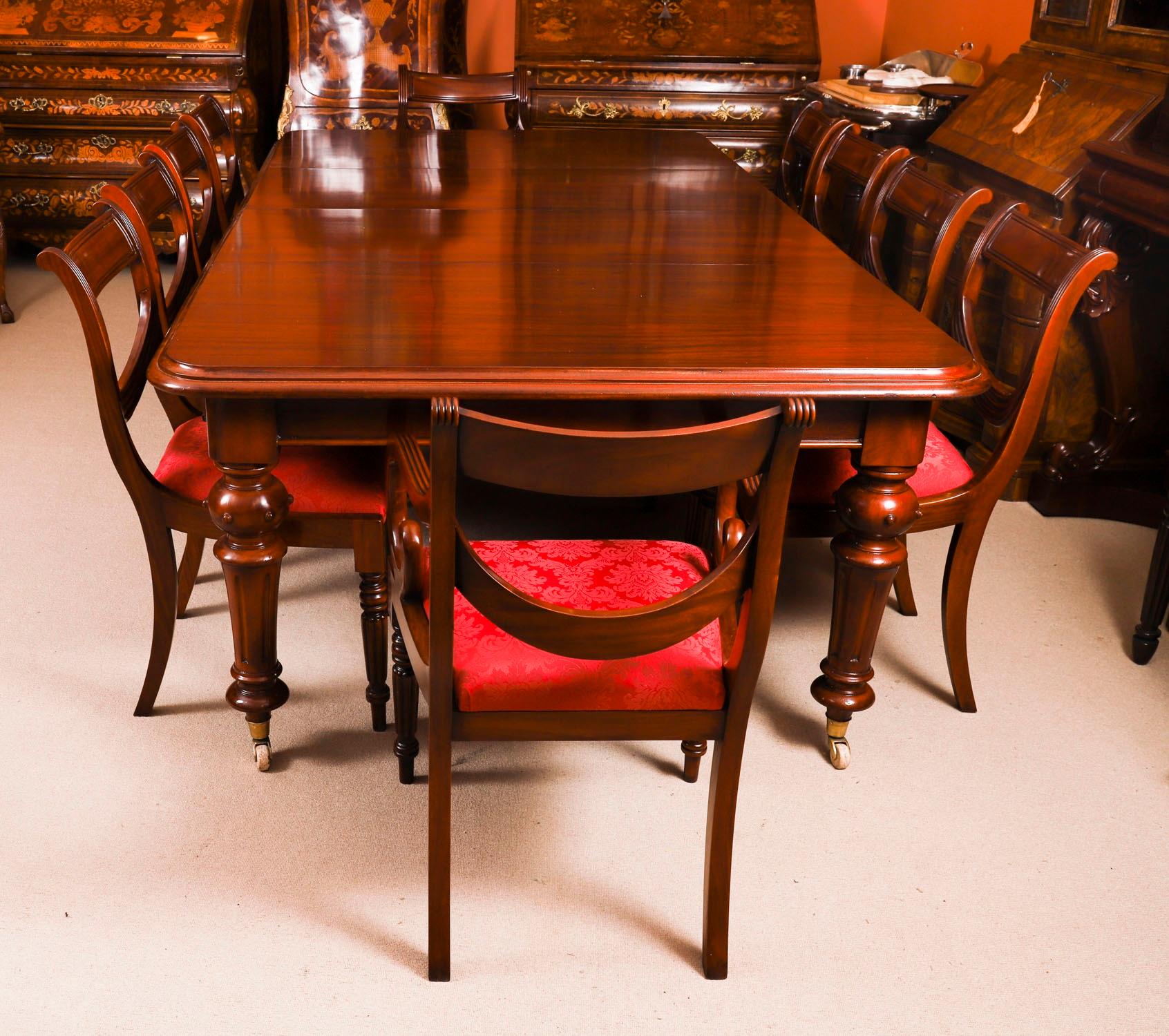 This is a magnificent antique Victorian dining set that comprised a solid mahogany wind out dining table Circa 1870 in date and a set of ten Regency revival bar back dining chairs.

This beautiful table is in stunning flame mahogany and has two