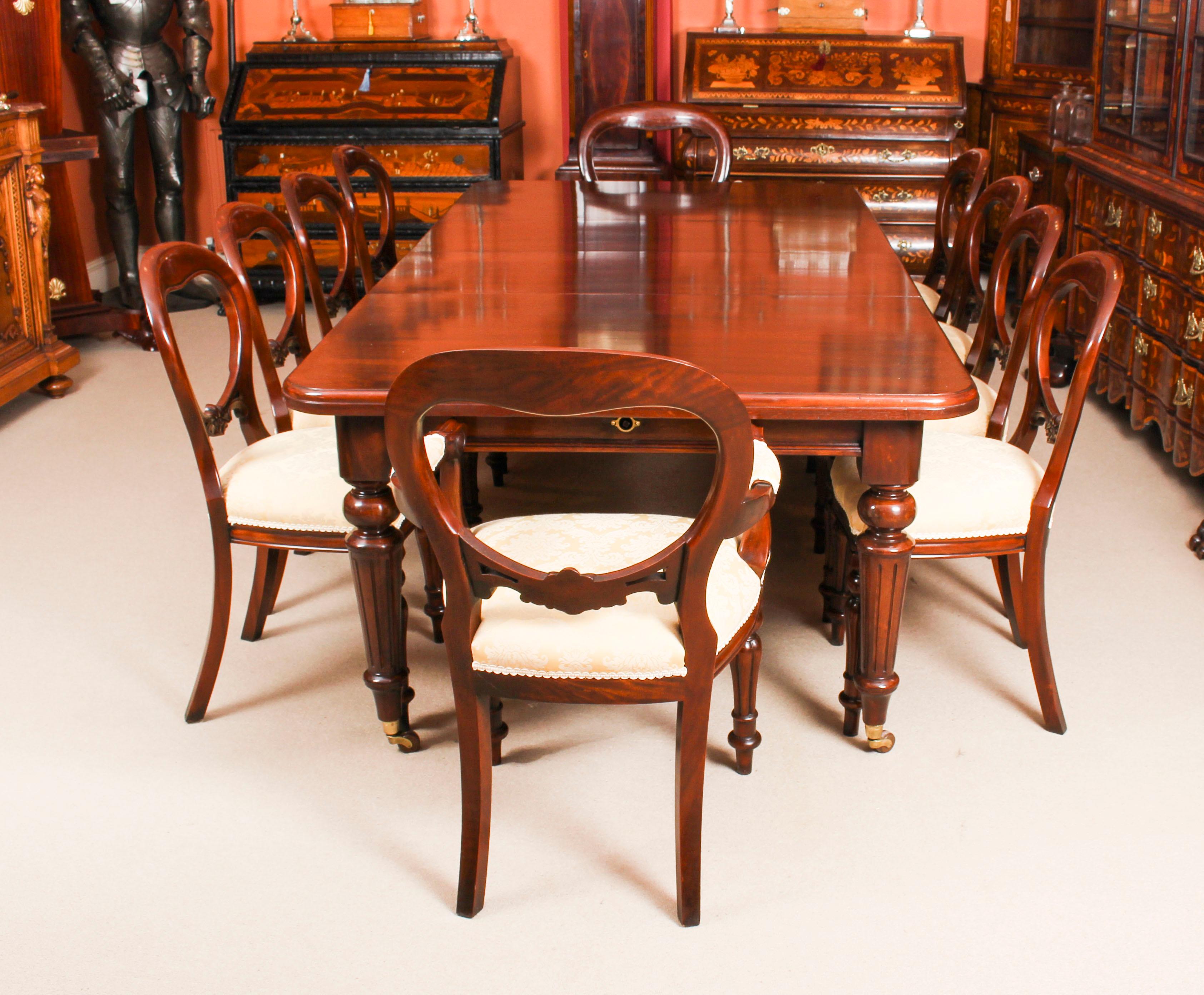 This is a magnificent antique Victorian solid mahogany wind out dining table and ten balloon back dining chairs, circa 1870 in date.
 
This beautiful table is in stunning mahogany and has two leaves of forty five cm each, which can be added or