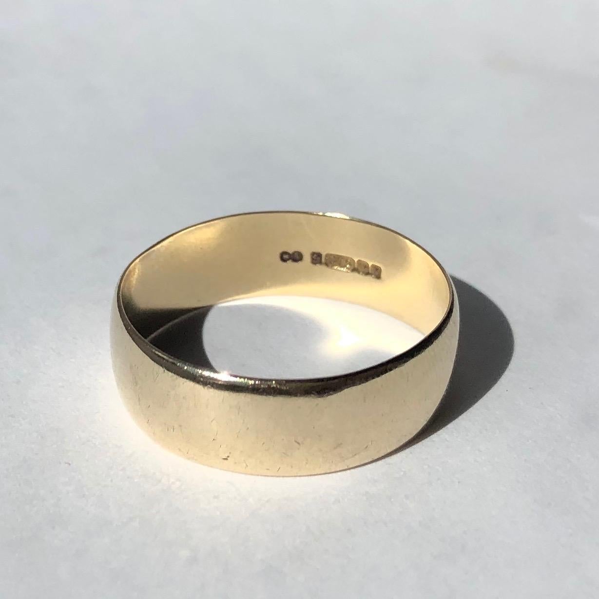 This band is plain and modelled in glossy 9ct gold. It could be worn as an every day ring or a classic wedding ring. Made in Birmingham England. 

Ring Size: Y or 12
Band Width: 7mm 

Weight: 3.99g