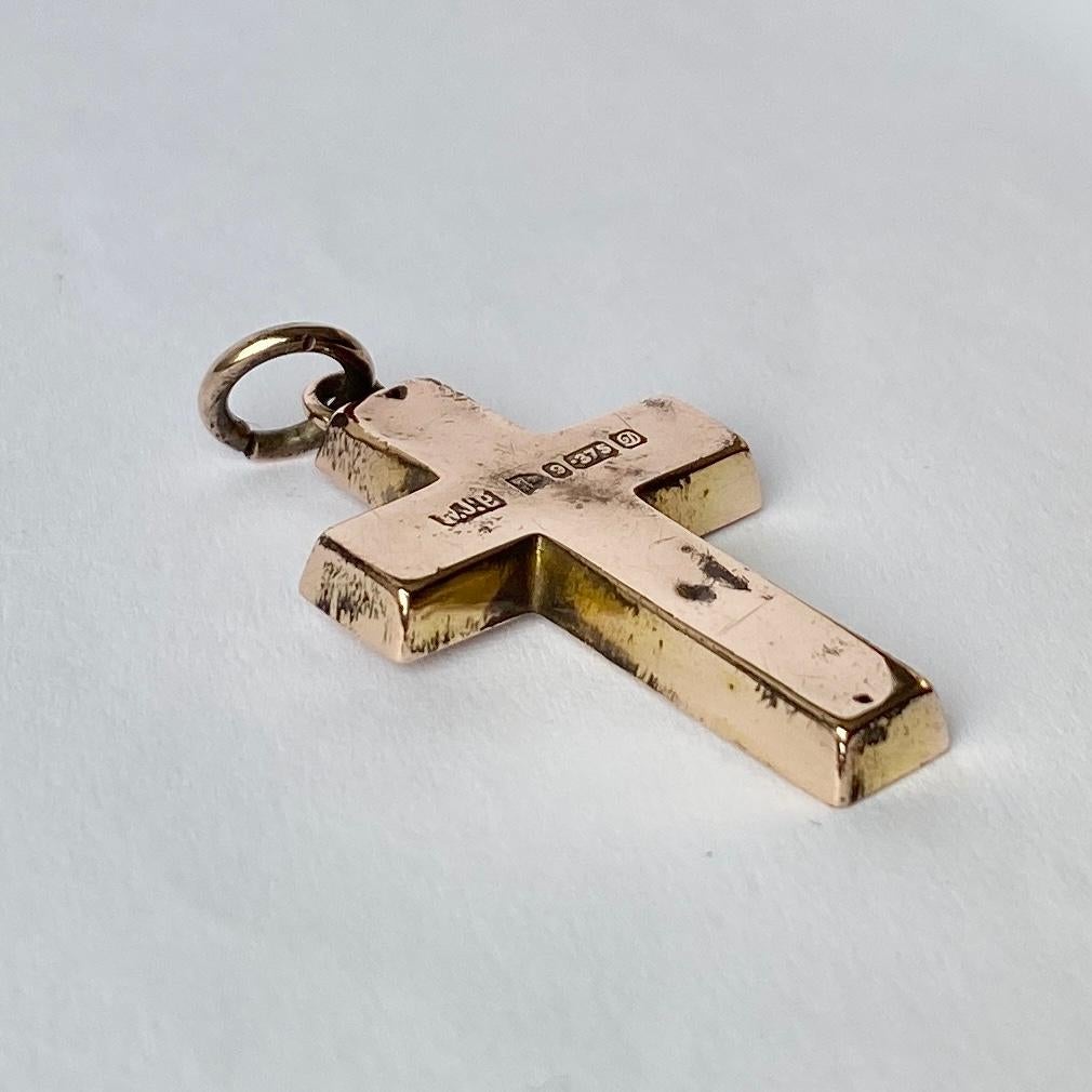This finely engraved cross is a classic piece. The back of the cross is smooth with the hall mark so you could wear it with the engraved detail or the smooth simple side showing. Modelled in 9ct gold and hallmarked Chester 1904.

Cross Dimensions: