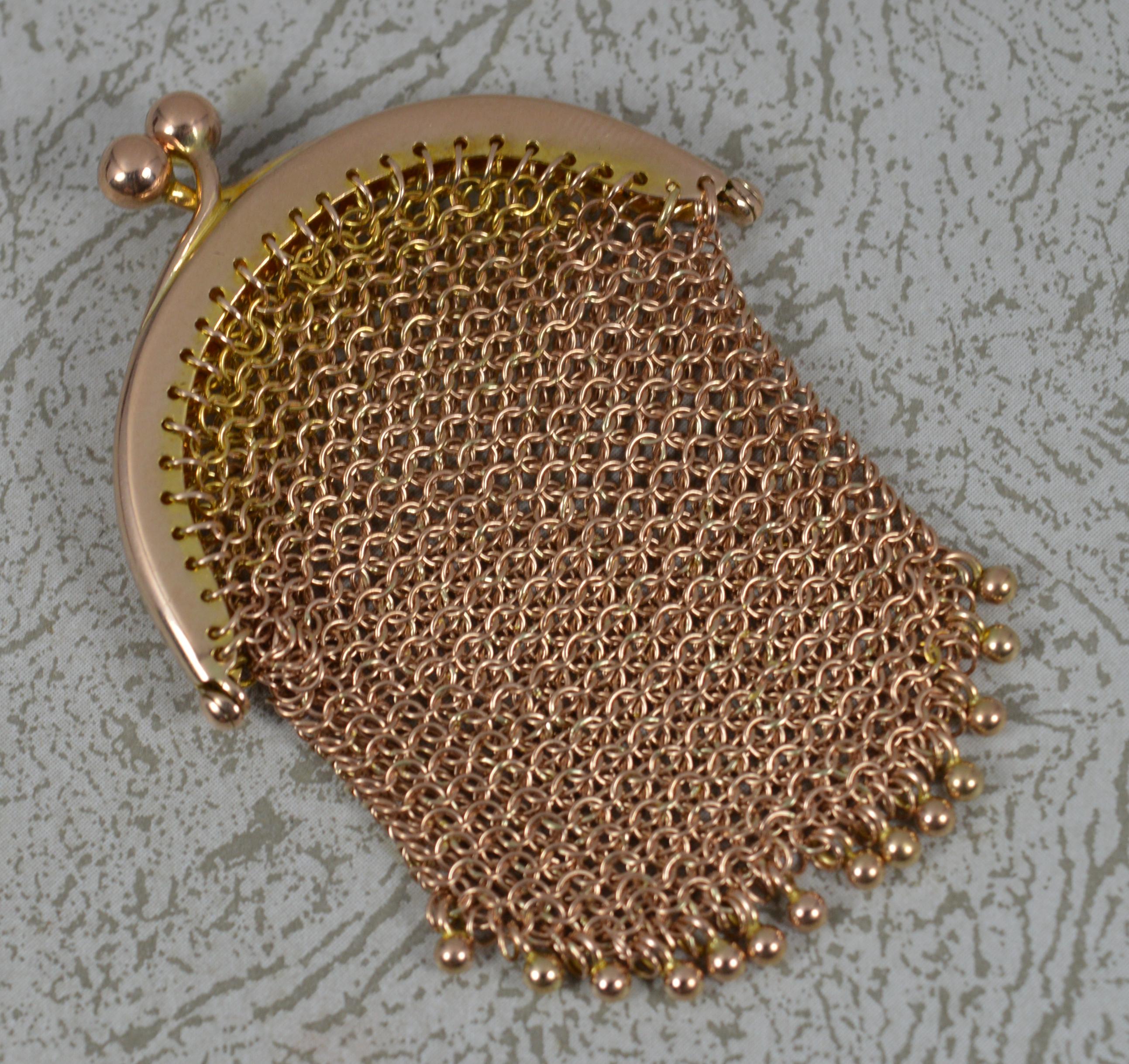 A very fine antique 9ct gold chain mail purse.
Well made example in solid 9 carat rose gold.
A chain mail link with plain top and two ball clasp with ball drops.

Hallmarks ; 9ct
Weight ; 12.2 grams
Size ; 44mm x 60mm bag approx
Condition ; Very