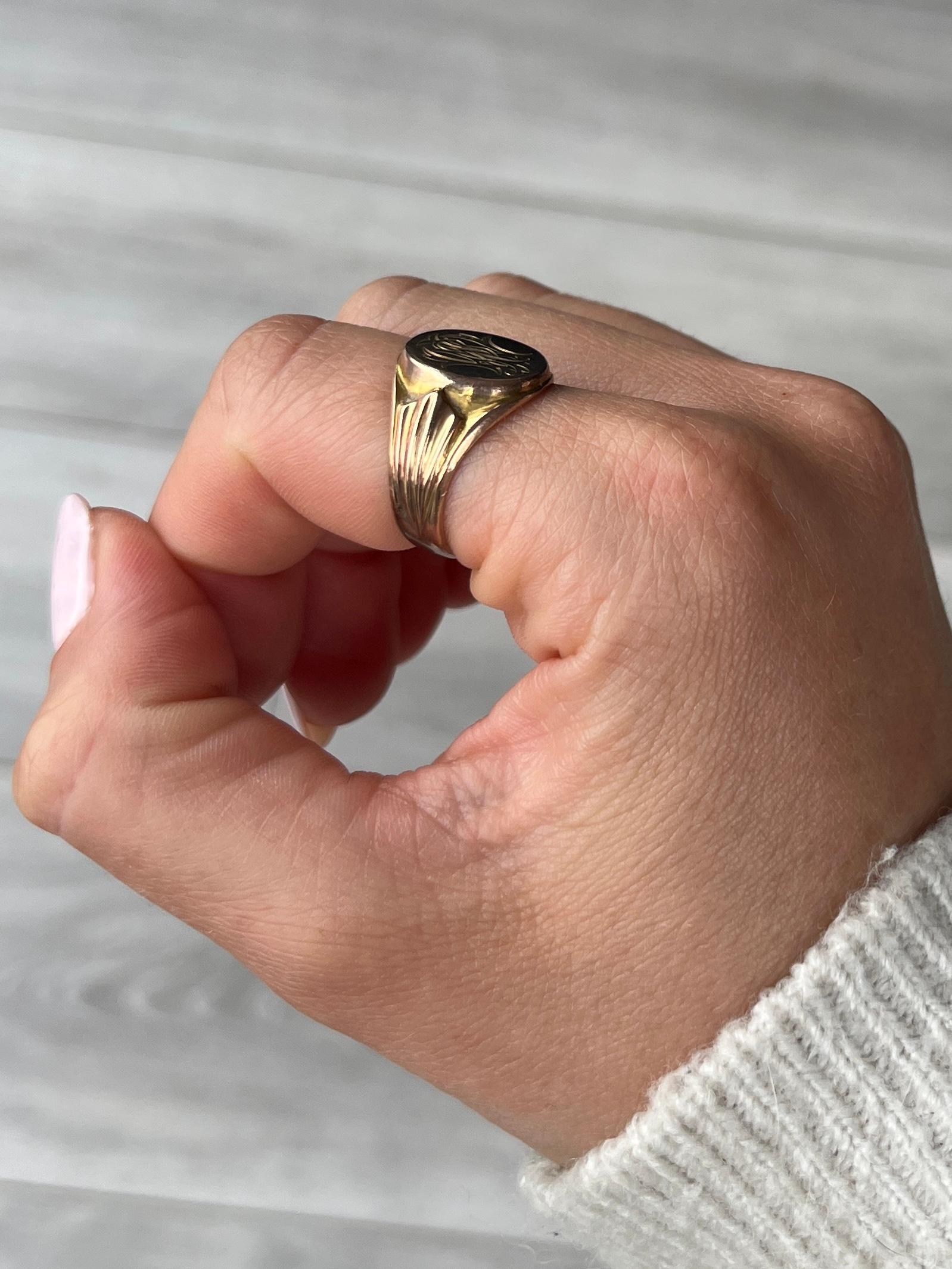 This sweet signet is modelled in 9ct rose gold. The colour of the ring is very soft rose gold. The initials read 'J B W' and can be read in any order. On the back of the face there is an inscription that reads 'W.J.W 2nd July 1916'.

Ring Size: O or