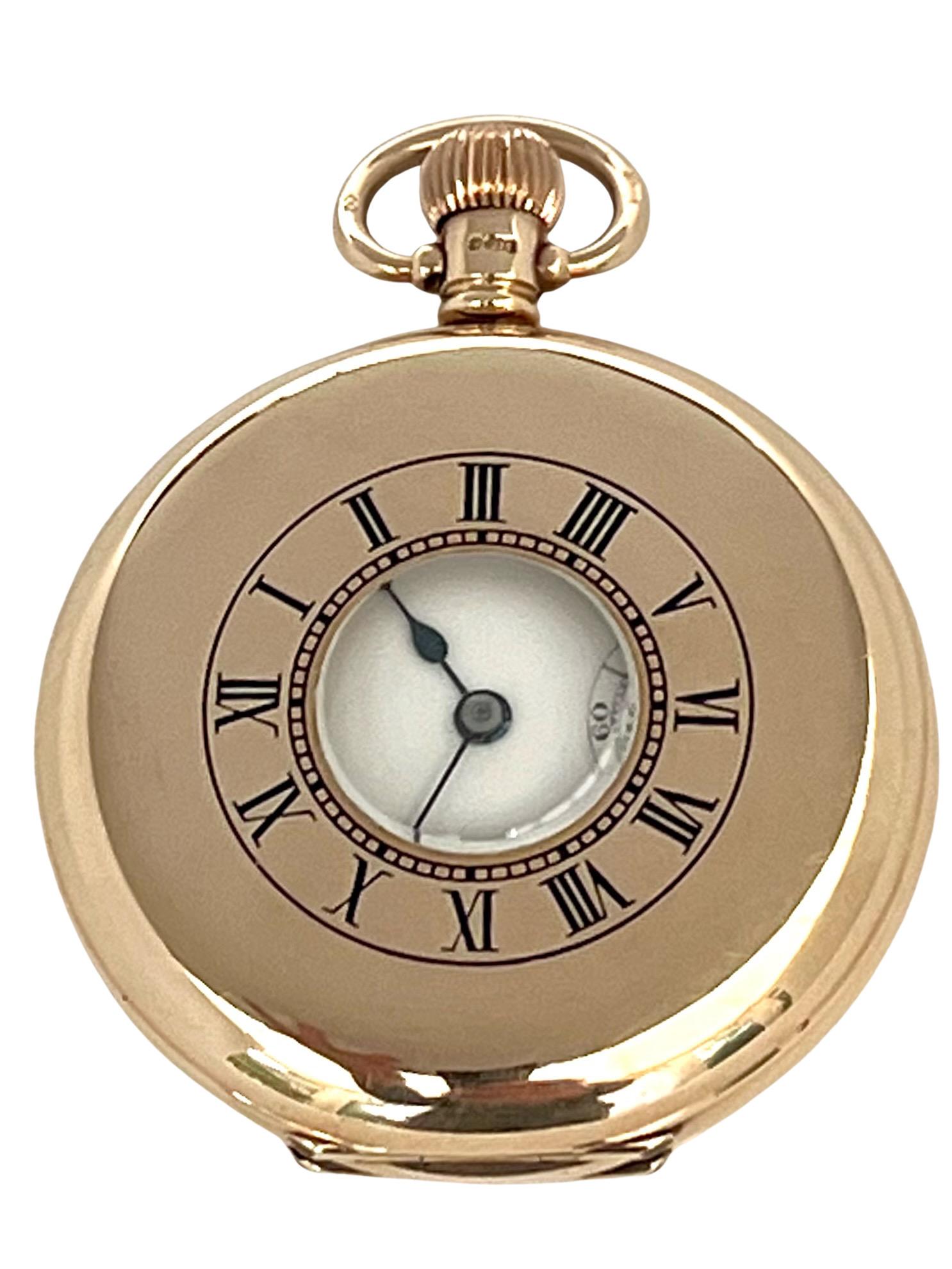 A substantial 9 carat solid gold half hunter pocket watch by Marvin Watch Company, Switzerland. Fully hallmarked Birmingham, 1912.

With a gold winding crown and bow to the top, the outer engraved Roman dial on the case front with central glass and