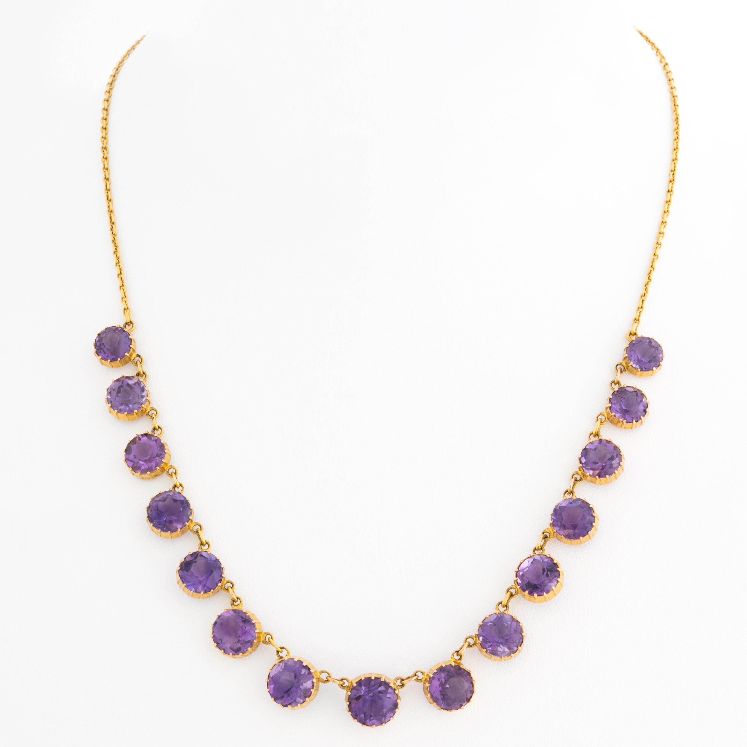 Antique 9 Karat and Natural Amethyst Graduated Rivière Necklace

L 43.7 cm x W 0.98 cm  /  17.2 in. x 0.39 in.
Large Center Stone: W 0.985 cm x 0.985 cm / 0.39 in. x 0.39 in.
Smallest Stone: W 0.743 cm x 0.743 cm / 0.293 in. x 0.293 in.
13.1 grams
