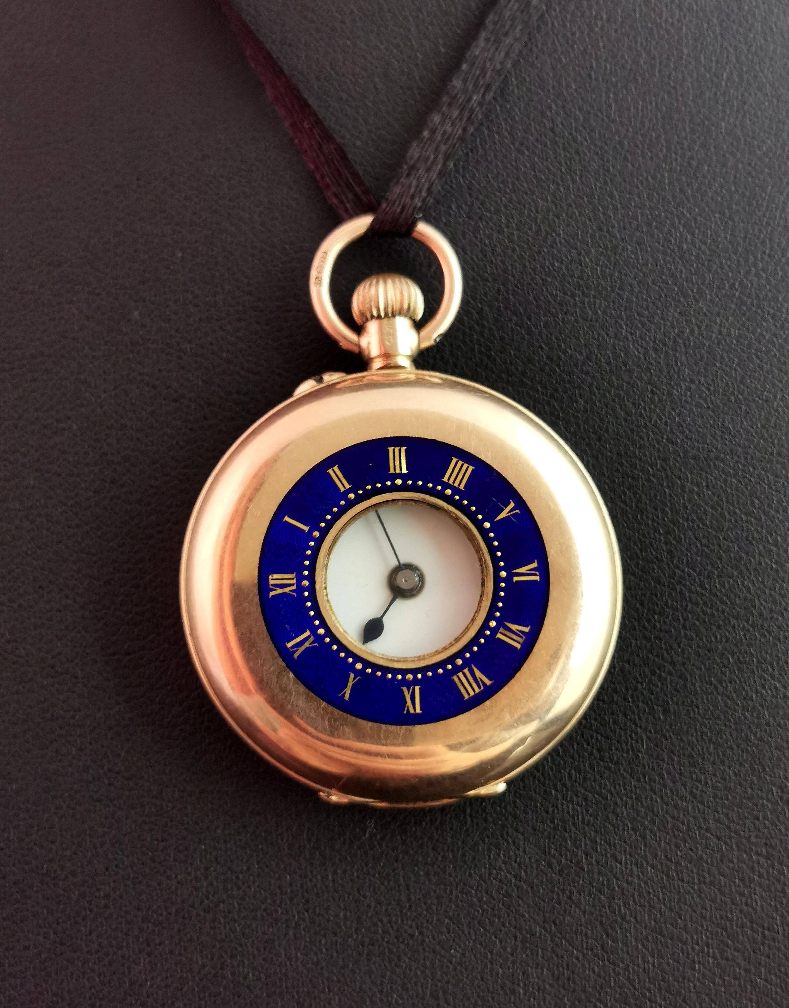 A beautiful antique 9 karat gold and blue enamel half hunter pocket watch or fob watch.

It is a smaller sized watch, suitable for ladies or gents.

It has blue enamel band to the front outer case with gold gilt roman numerals picked out.

Fully
